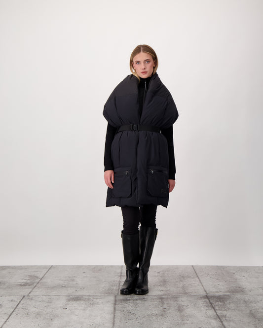 Chroma Unisex Oversized Puffer Scarf in stretch ripstop and taffeta nylon in a quilted pattern, Canadian White Duck Down insulation, cobra buckle belt with webbing strap, and large zipper pocket at scarf end, in Black