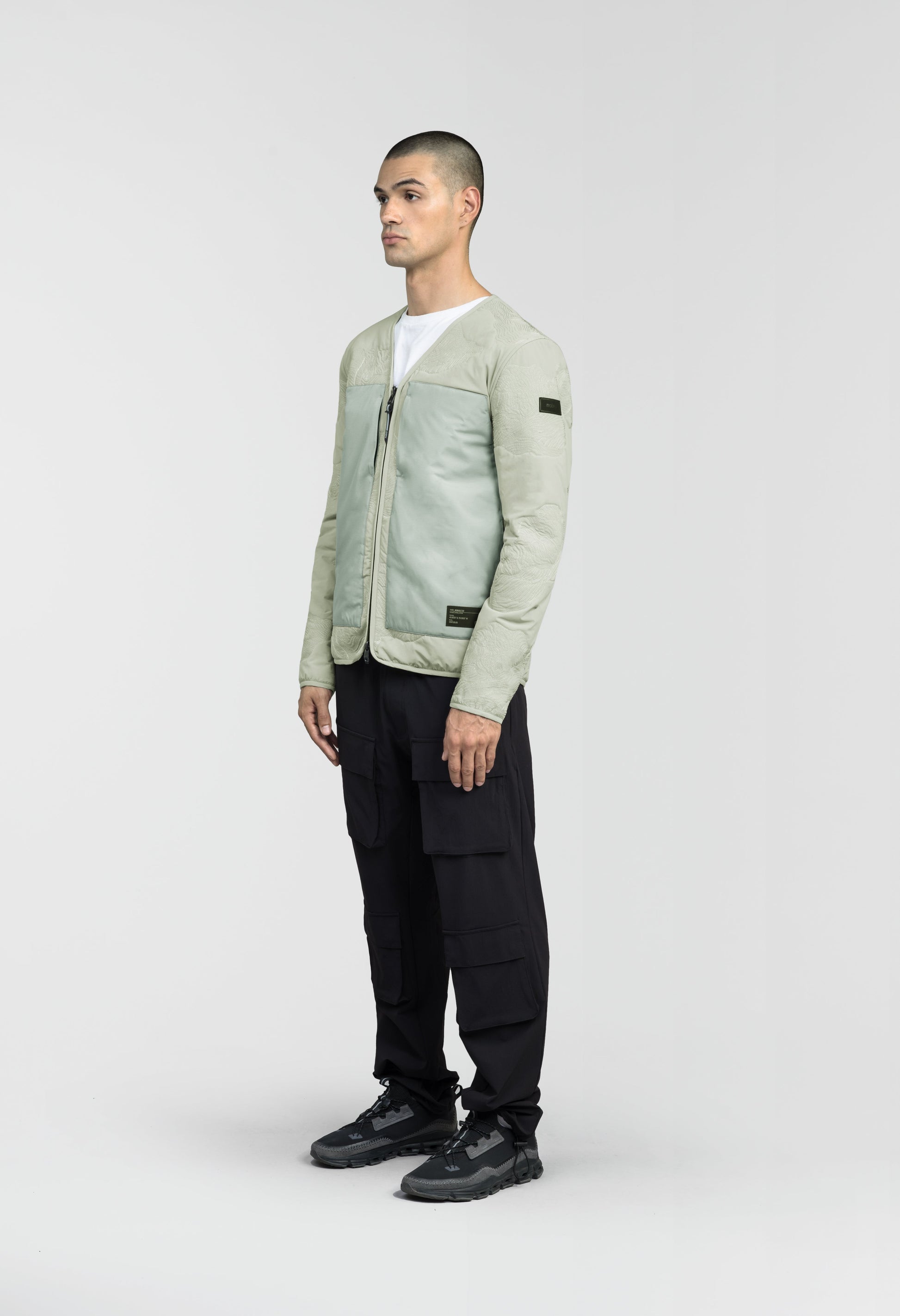 Gates Men's Performance Quilted V-Neck Jacket in hip length, centre front two-way zipper, hidden zipper chest pockets, side entry waist pockets, in Tea