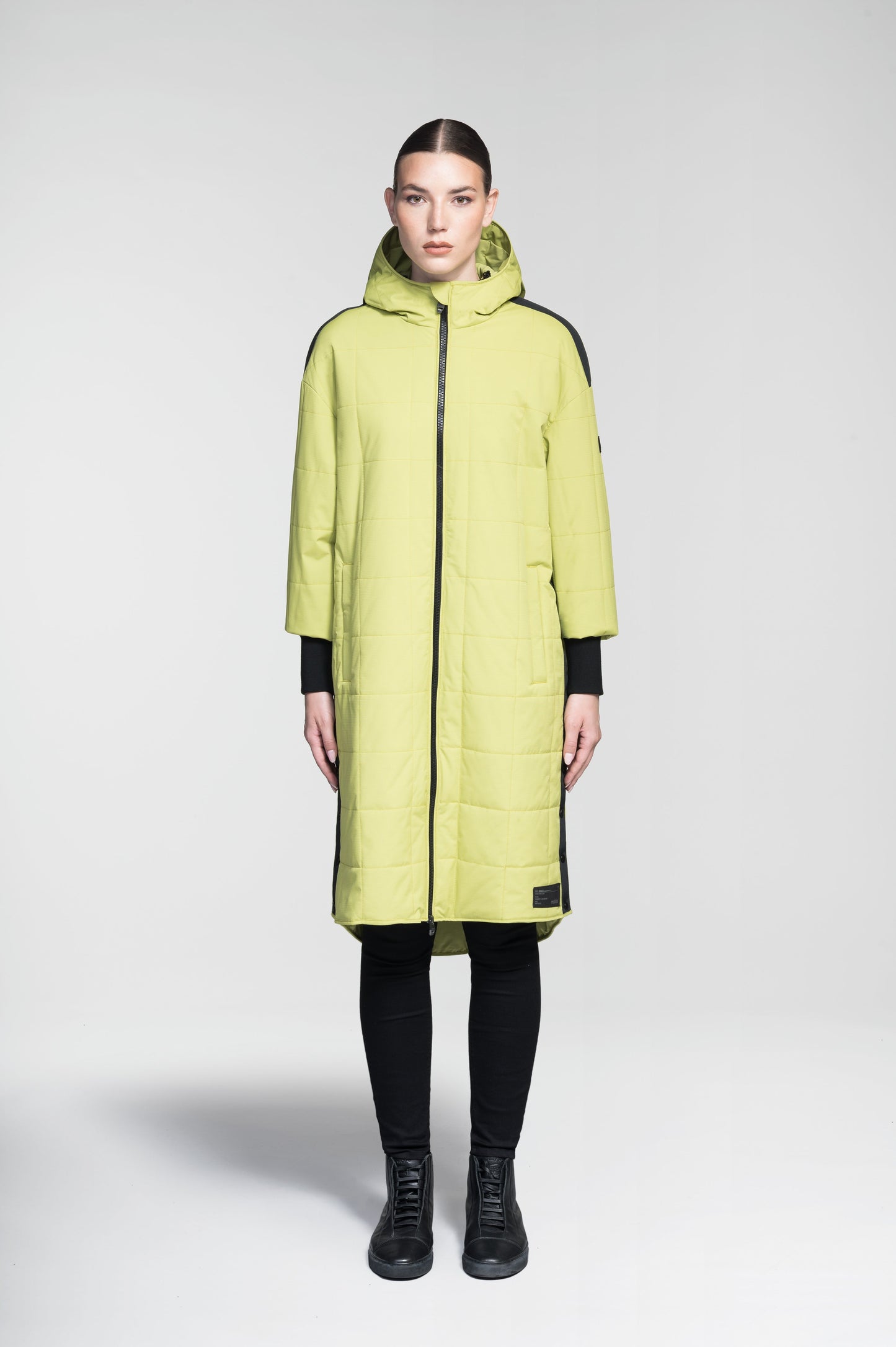 Radar Women's Performance Long Midlayer Jacket in long length, premium stretch ripstop and stretch Toray nylon fabrication, premium 4-way stretch, water resistant Primaloft Gold Insulation Active+, non-removable hood with adjustable draw cord, 2-way branded zipper at centre front, single welt pockets with magnetic closure at hips, elongated ribbed cuffs, grosgrain ribbon detail at shoulder and side seams, and snap closure side seam vent, in Dark Citron