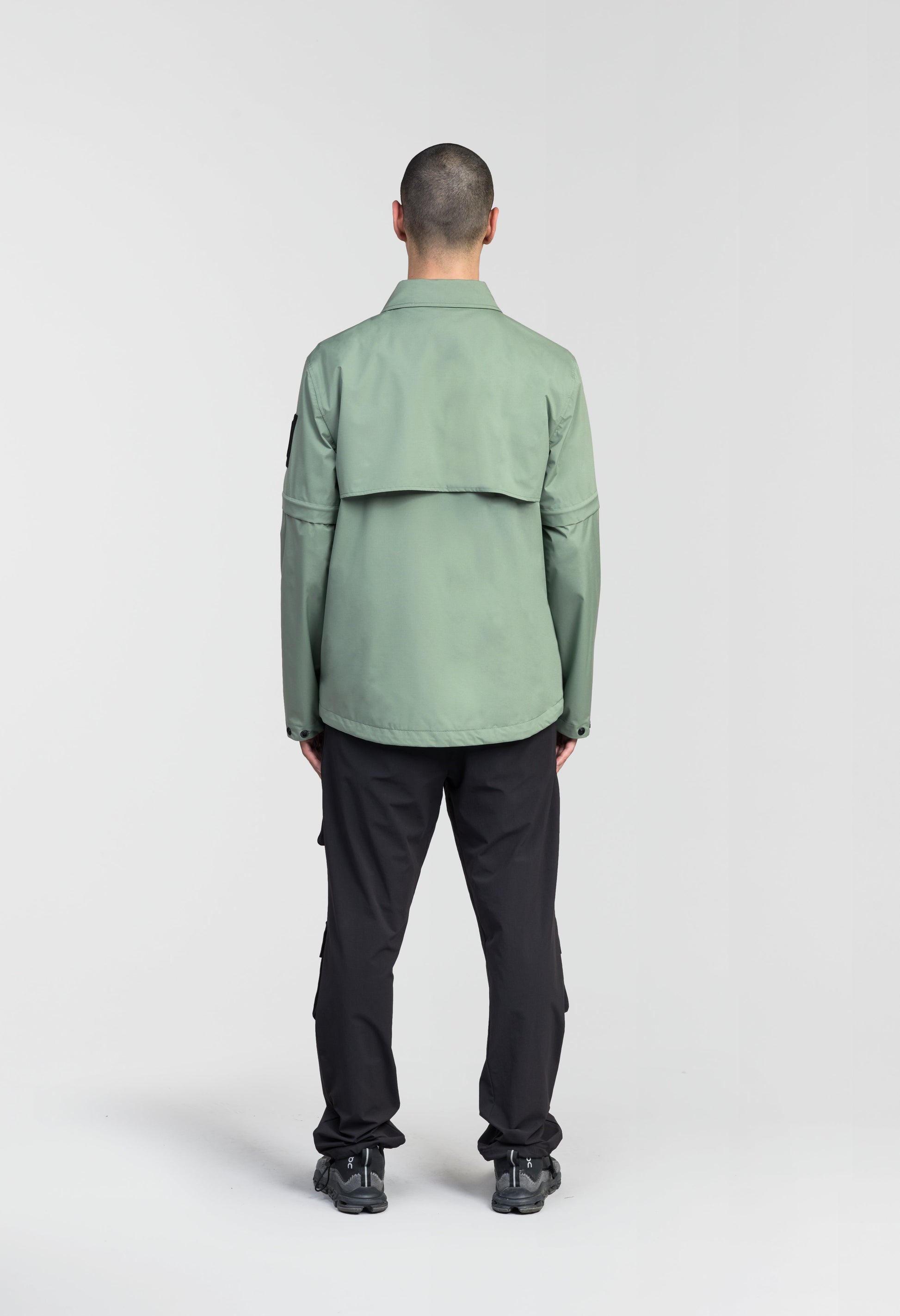 Thurlow Men's Performance Zip Off Sleeve Rain Shirt in hip length, convertible collar, patch chest zipper pockets, hidden in-seam pockets, zip off sleeves, centre front two-way zipper closure, in Duck Green