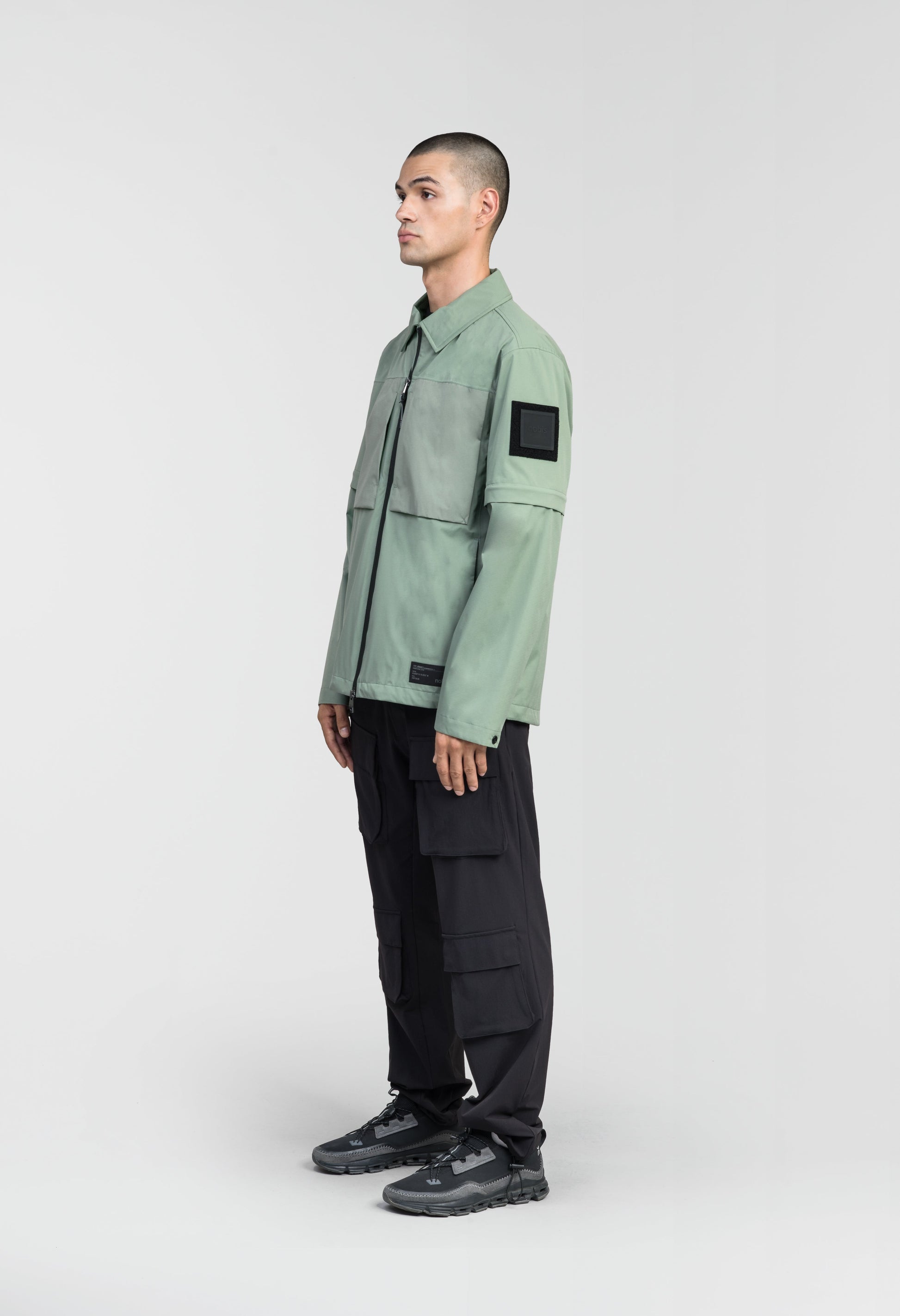 Thurlow Men's Performance Zip Off Sleeve Rain Shirt in hip length, convertible collar, patch chest zipper pockets, hidden in-seam pockets, zip off sleeves, centre front two-way zipper closure, in Duck Green