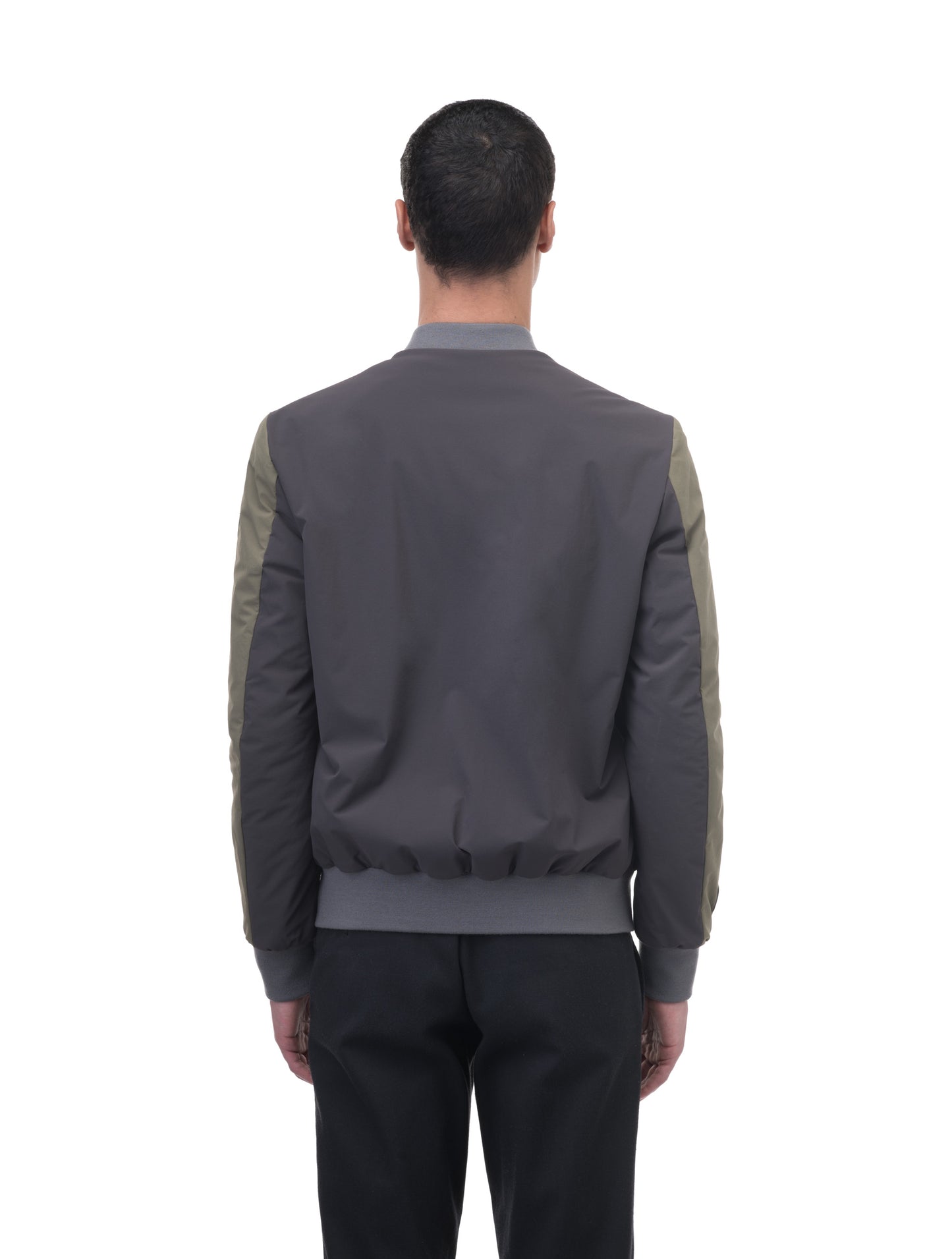 Unisex hip length bomber jacket with a contrast colour back panel, and zipper pockets at waist and an invisible zipper pocket at chest, in Dusty Olive/Licorice