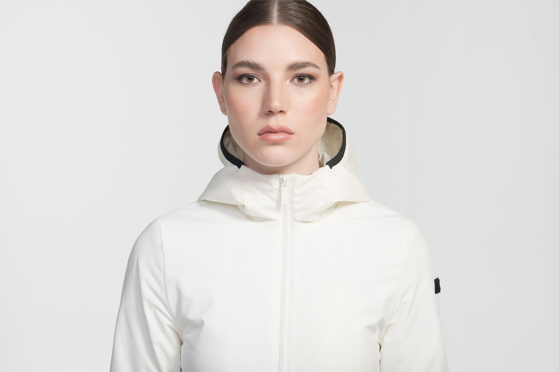 Ladies hip length mid layer jacket with non-removable hood and two-way zipper in Chalk