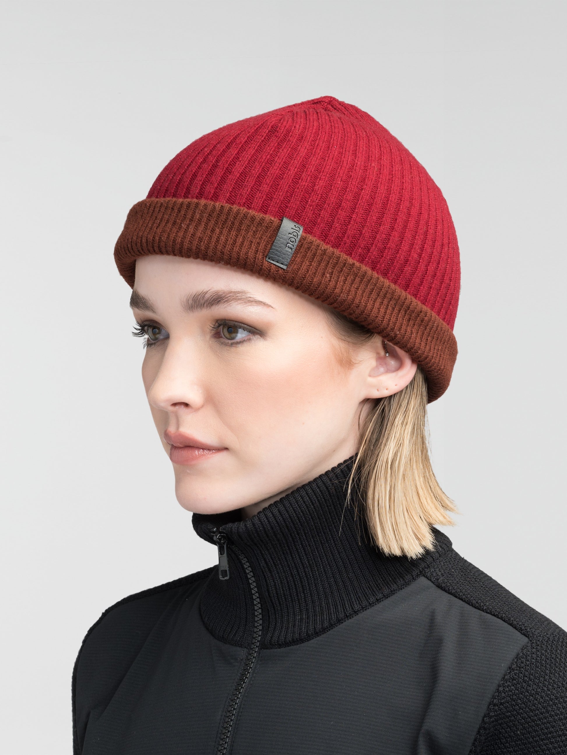 Ardn Unisex Tailored Reversible Knit Beanie in an extra fine merino wool blend, fitted rib knit, and reversible design, in Potent Purple/Rio Red