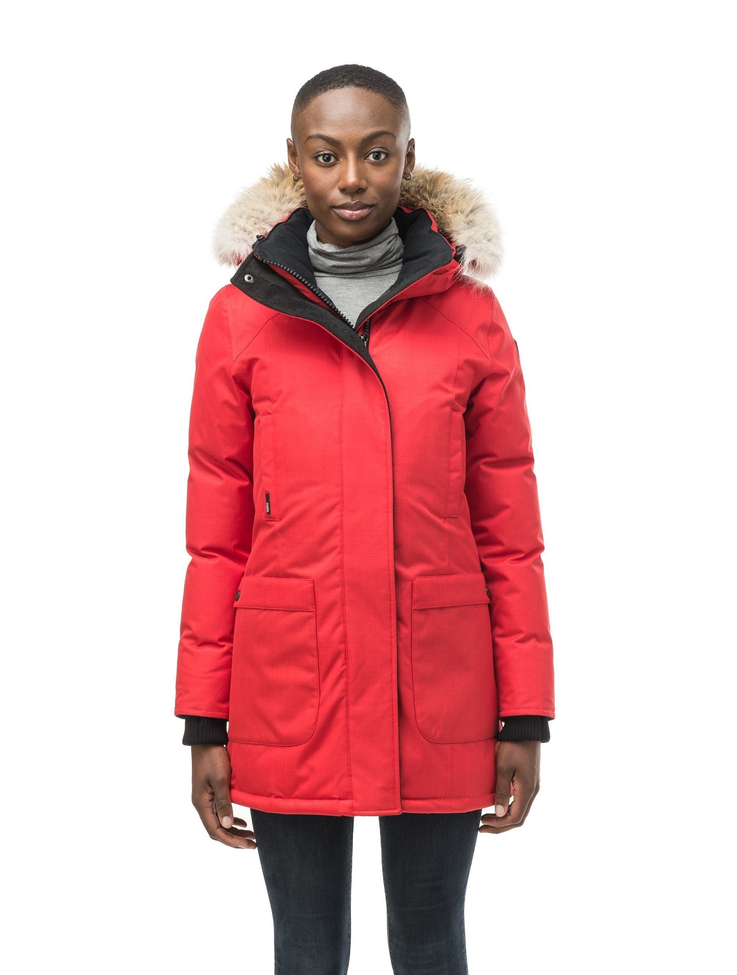 Women's down filled parka that sits just below the hip with a clean look and two hip patch pockets in CH Red