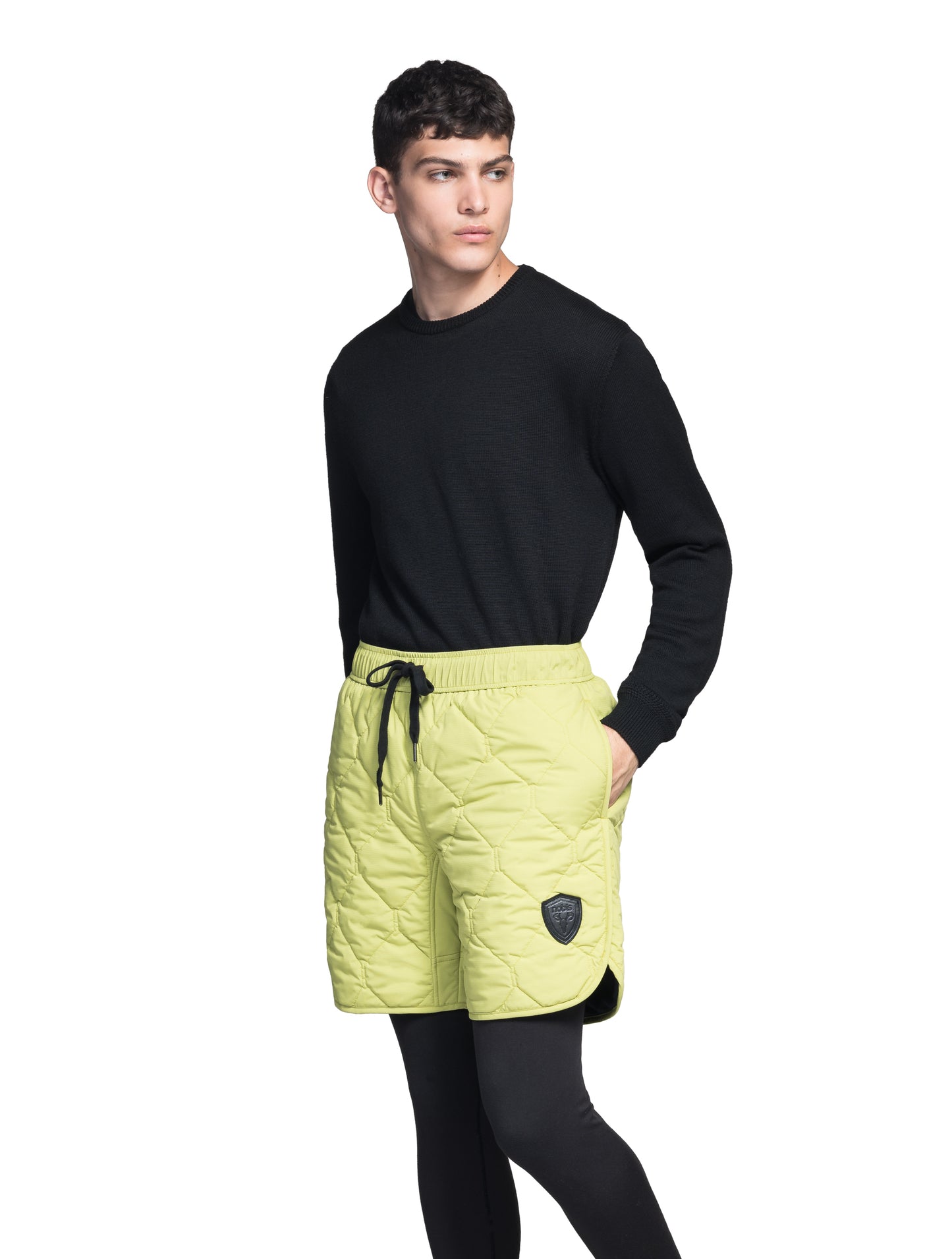 Curt Men's Performance Quilted Shorts at knee length, premium stretch nylon and stretch ripstop fabricaiton, premium 4-way stretch, water resistant Primaloft Gold Insulation Active+, side seam pockets, exteriror back pocket, elasticized waist with drawcords, and notch detailing at side seams, in Dark Citron