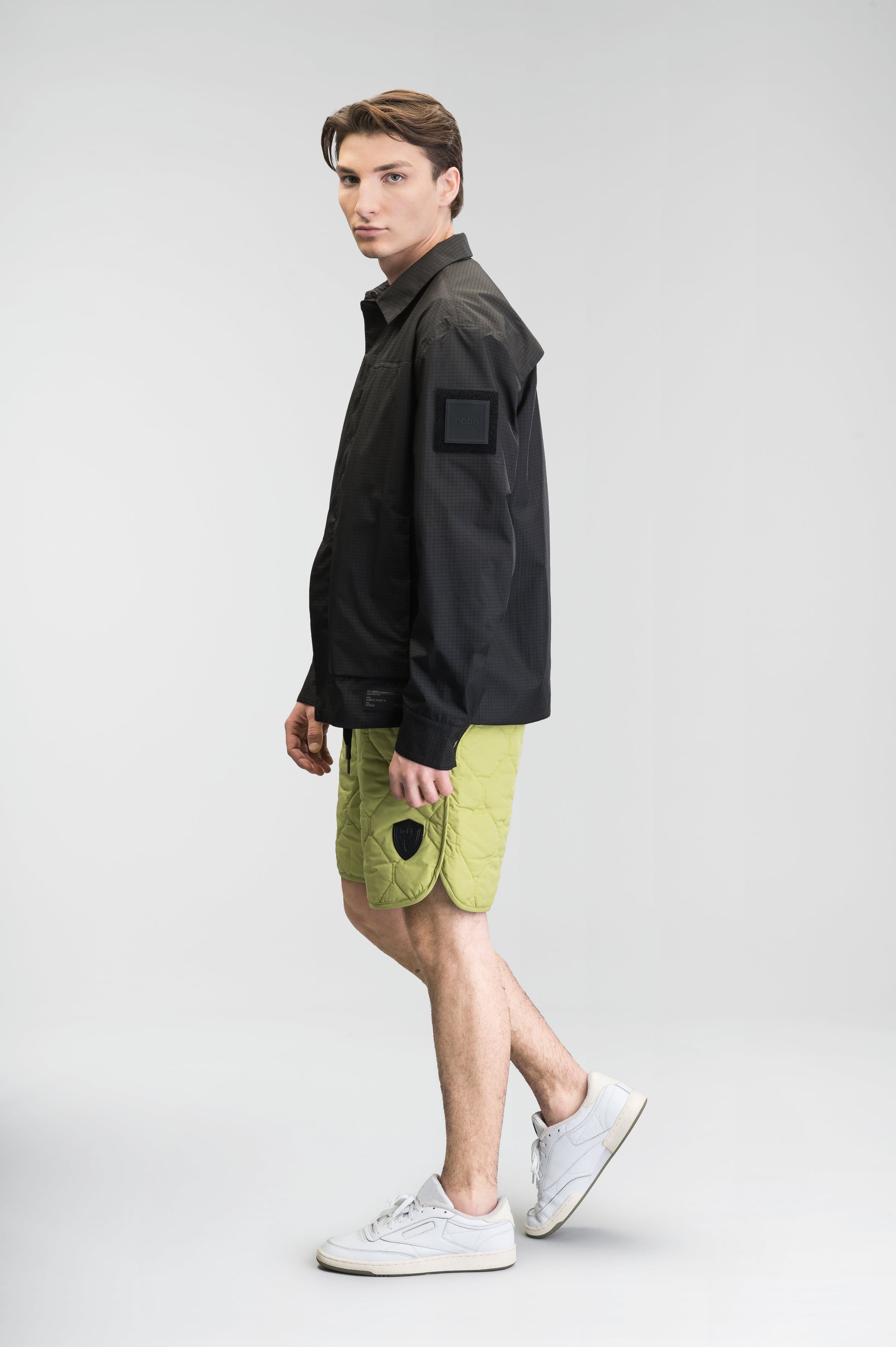 Curt Men's Performance Quilted Shorts at knee length, premium stretch nylon and stretch ripstop fabricaiton, premium 4-way stretch, water resistant Primaloft Gold Insulation Active+, side seam pockets, exteriror back pocket, elasticized waist with drawcords, and notch detailing at side seams, in Dark Citron