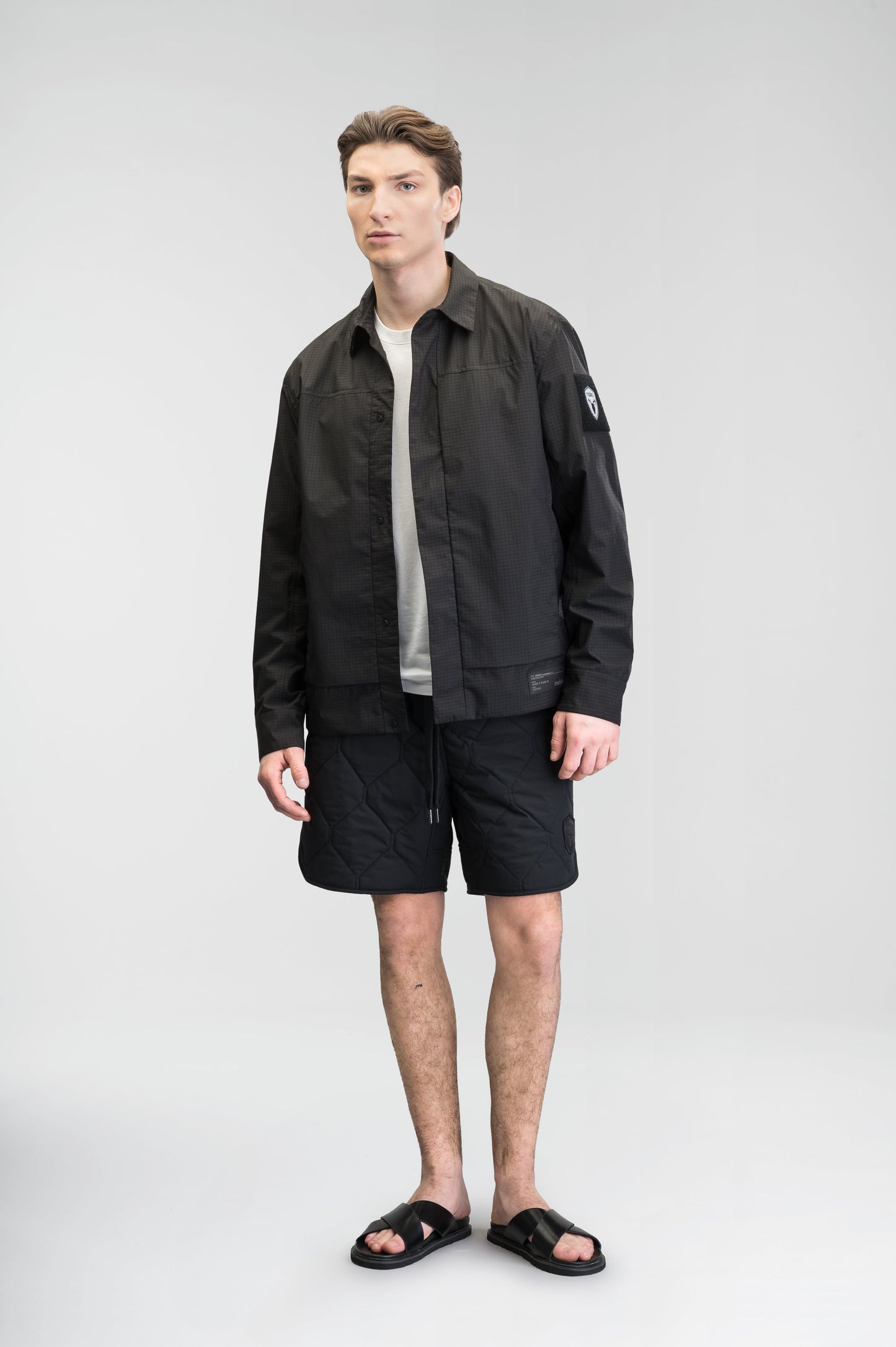 Curt Men's Performance Quilted Shorts at knee length, premium stretch nylon and stretch ripstop fabricaiton, premium 4-way stretch, water resistant Primaloft Gold Insulation Active+, side seam pockets, exteriror back pocket, elasticized waist with drawcords, and notch detailing at side seams, in Black