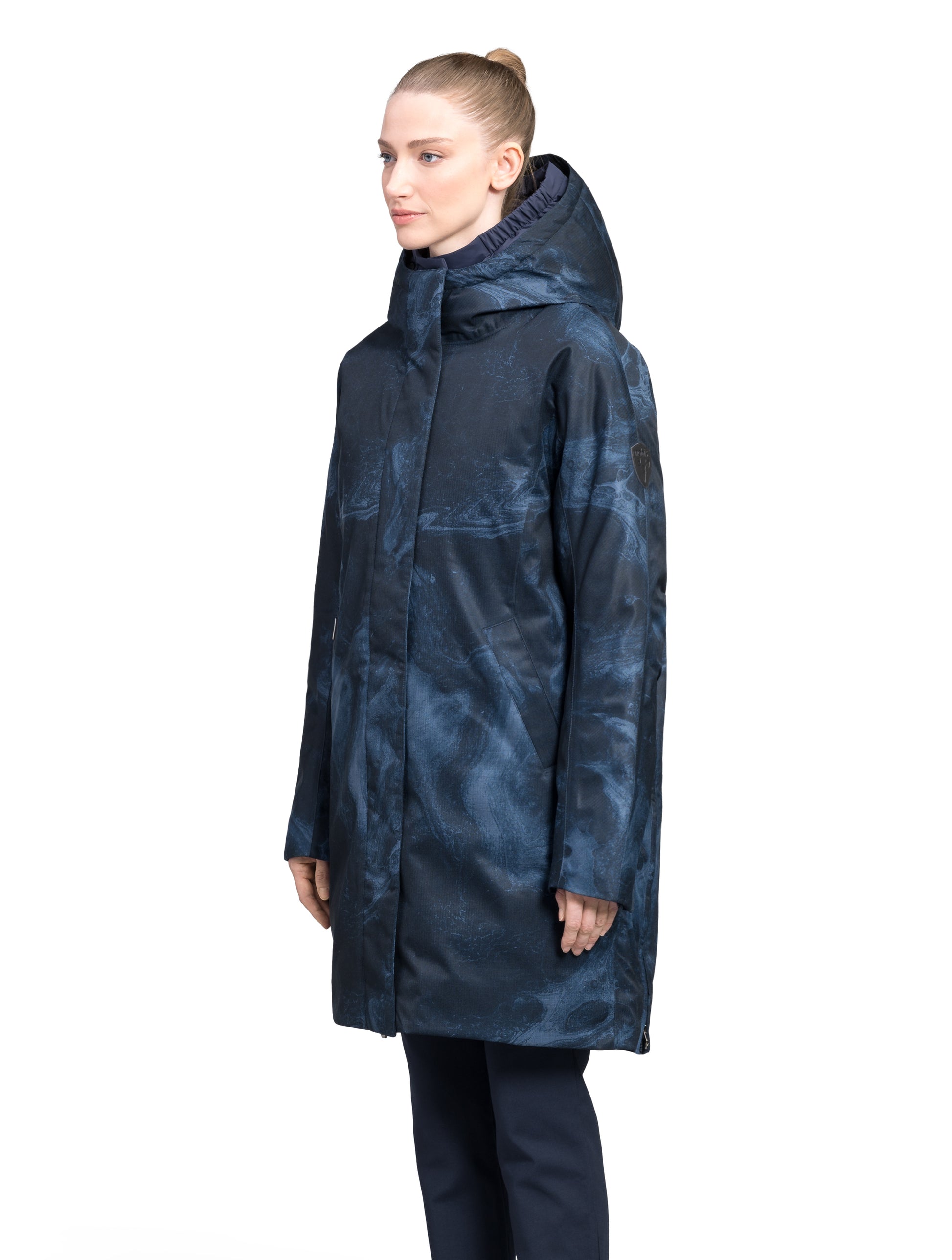 Dory Women's Tailored Back Zip Parka in knee length, premium Crosshatch fabrication, Premium Canadian White Duck Down insulation, non-removable down-filled hood, removable interior hood, centre front two-way zipper with wind flap, vertical zipper detailing along back, in Navy