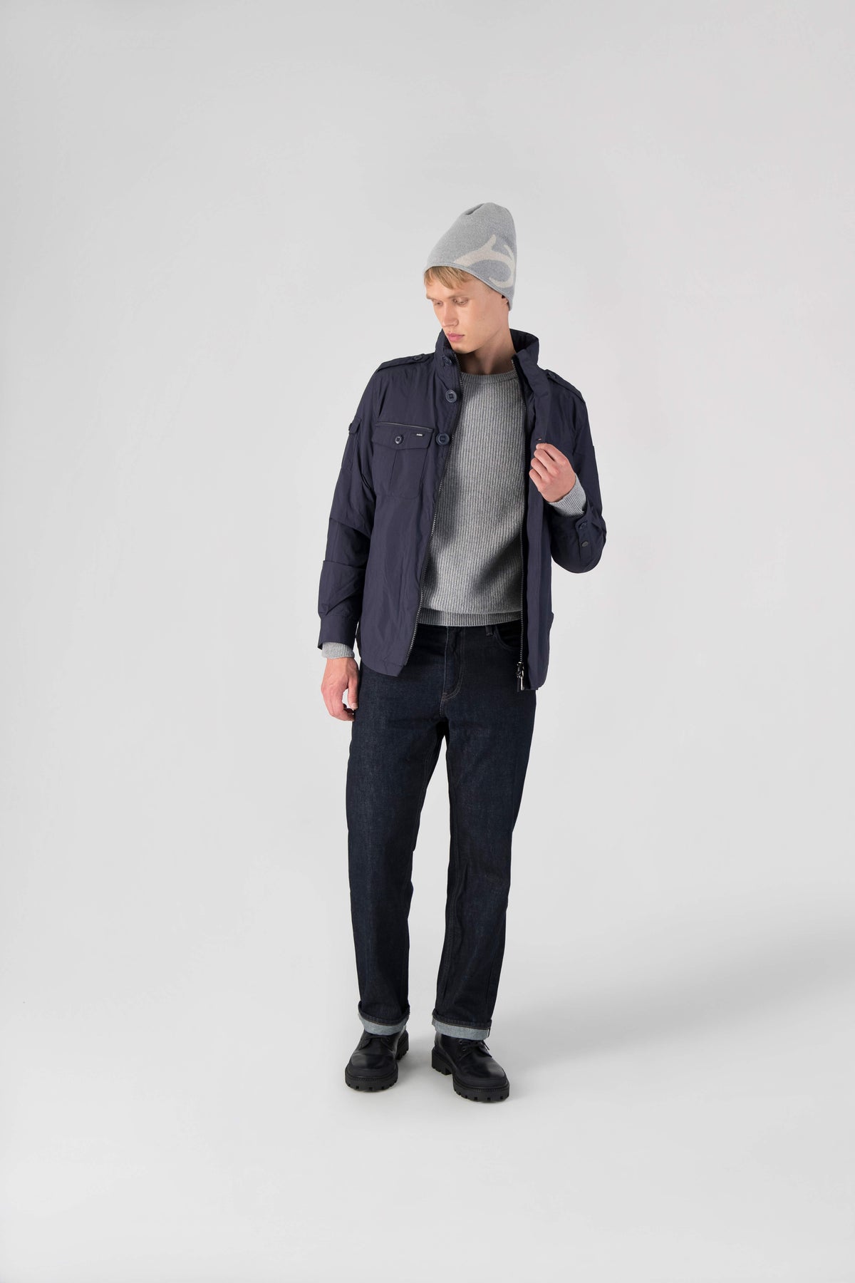 Fisherman is a men’s lightweight waterproof jacket offering exceptional durability, crafted from matte technical taffeta with a breathable, seam-sealed construction for dependable weather protection in Marine