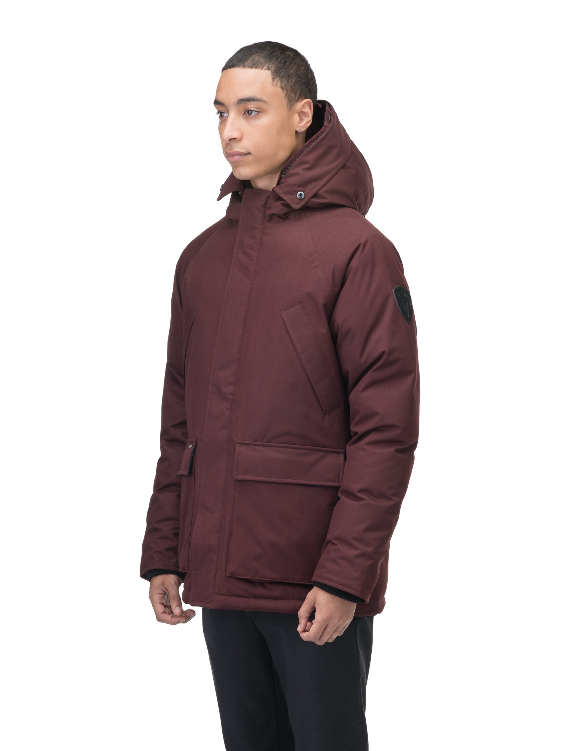 Heritage Furless Men's Parka in hip length, Canadian white duck down insulation, non-removable hood, front zipper with magnetic placket, chest hand warmer pockets, waist flap pockets, and elastic cuffs, in Merlot