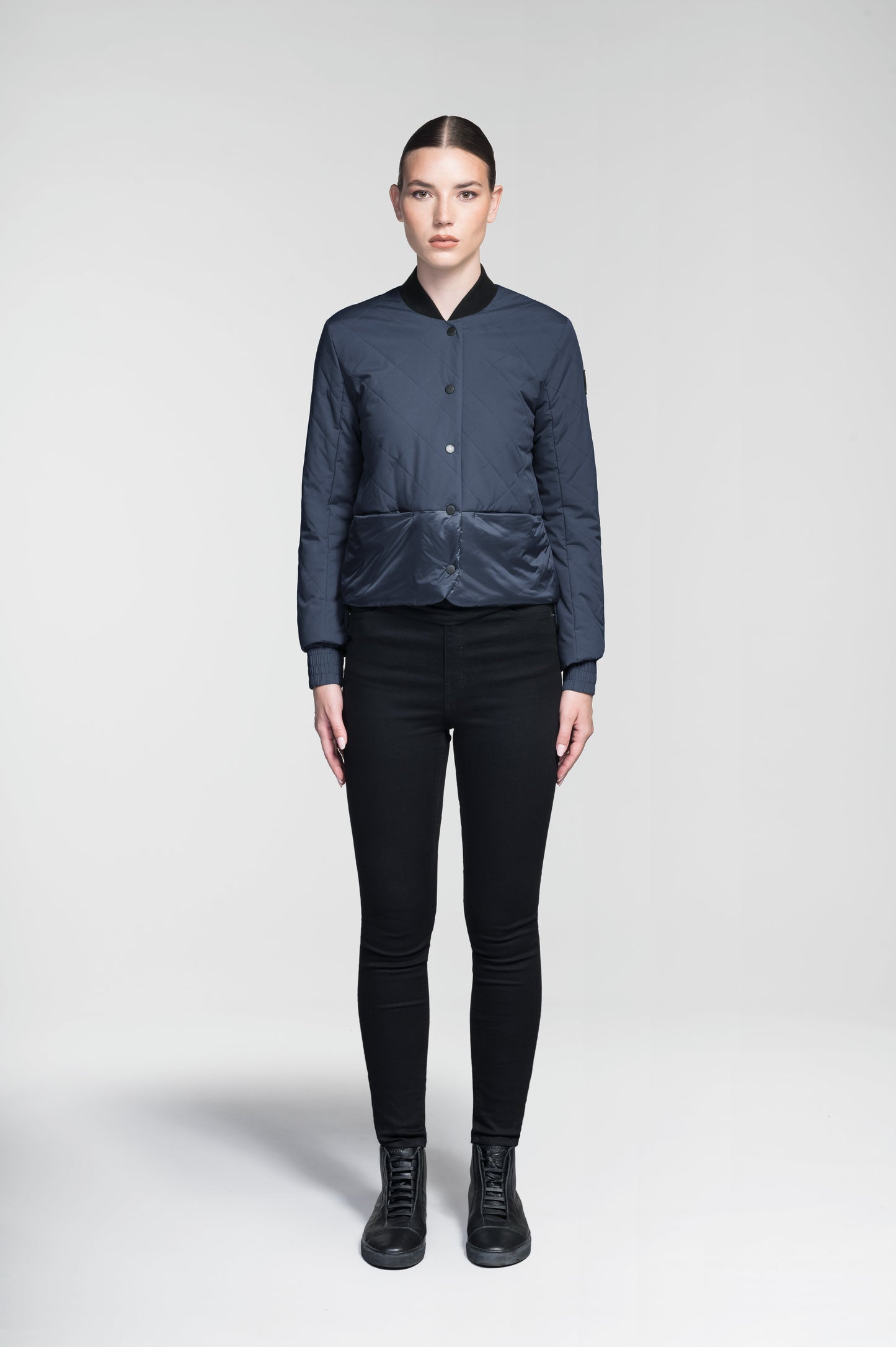 Lexi Women's Reversible Midlayer Jacket in waist length, premium stretch ripstop and contrast cire technical nylon taffeta fabrication, premium 4-way stretch, water resistant Primaloft Gold Insulation Active+, snap button closure at centre front, exterior magnetic closure pockets at sides, elasticized cuff details, and reversible from a quilted or smooth outer shell, in Marine