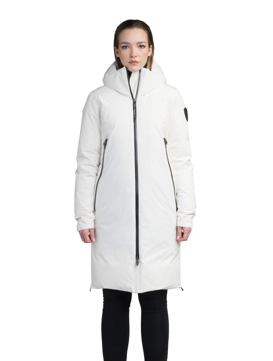Inara Women's Performance Parka in knee length, premium 3-ply micro denier and stretch ripstop fabrication with DWR coating, Premium Canadian White Duck Down insulation, non-removable down-filled hood, centre front two-way zipper, large vertical zipper pockets along waist, zipper vents along bottom side hem, in Chalk