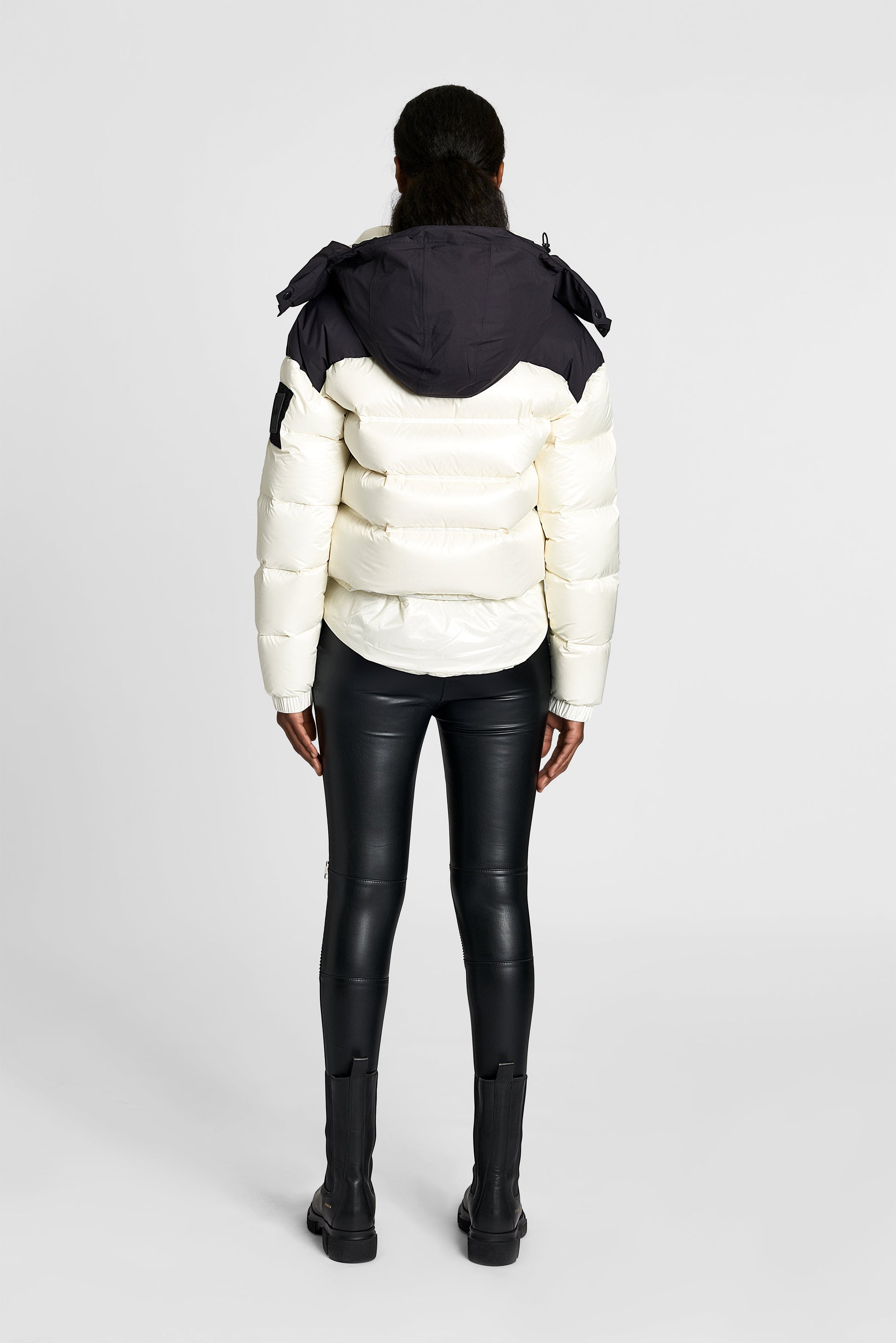 Tempus Women's Performance Short Puffer Jacket in waist length, premium technical nylon taffeta fabrication, Premium Canadian origin White Duck Down insulation, removable down-filled hood, two-way centre-front zipper, fleece-lined zipper pockets at waist, pit zipper vents, in Chalk