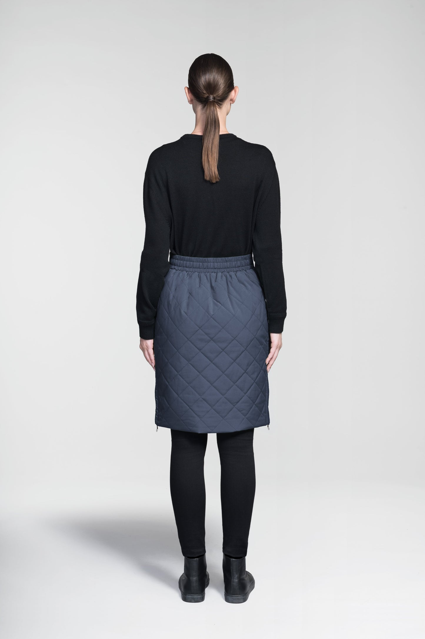 Phora Women's Tailored Skirt in knee length, premium stretch ripstop and contrast cire technical nylon taffeta fabrication, premium 4-way stretch, water resistant Primaloft Gold Insulation Active+, elasticated waistband with grosgrain ribbon drawstrings, two zipper pockets at waist, and zipper closure gusset at side seams, in Marine