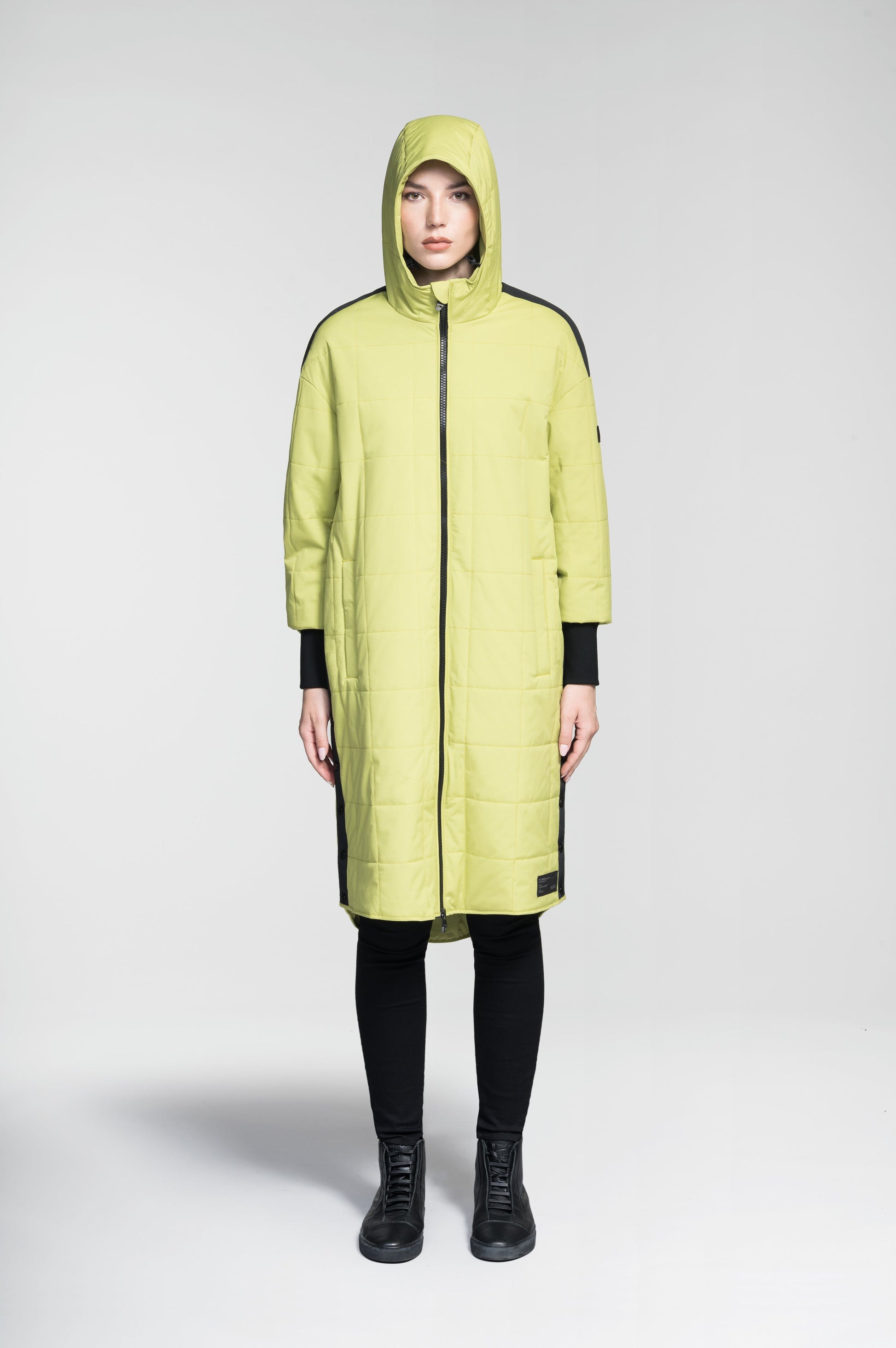 Radar Women's Performance Long Midlayer Jacket in long length, premium stretch ripstop and stretch Toray nylon fabrication, premium 4-way stretch, water resistant Primaloft Gold Insulation Active+, non-removable hood with adjustable draw cord, 2-way branded zipper at centre front, single welt pockets with magnetic closure at hips, elongated ribbed cuffs, grosgrain ribbon detail at shoulder and side seams, and snap closure side seam vent, in Dark Citron