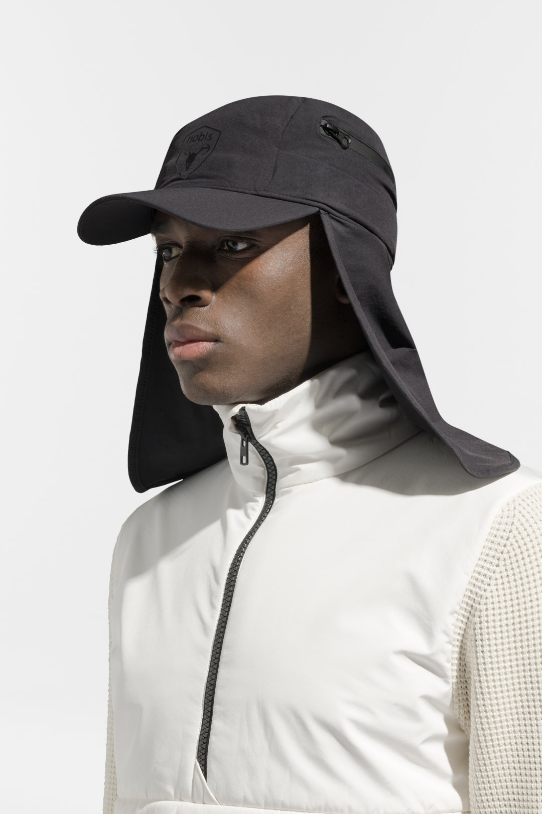Tal Unisex 3-in-1 cap in 5-panel construction, curved peak brim, back flap, adjustable cobra buckle at back, zipper pocket on left side crown, and detachable face covering, in Black