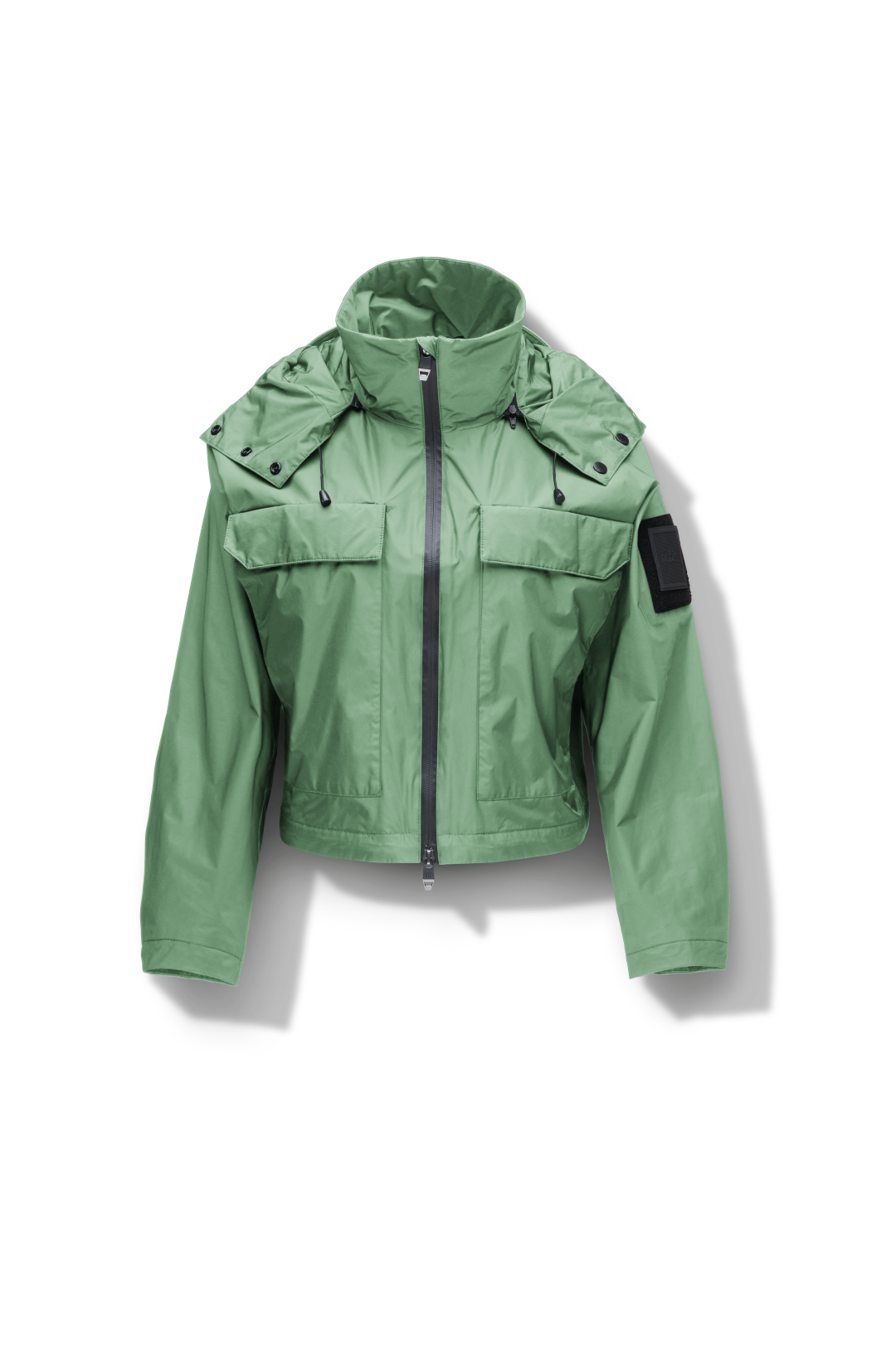 Viva Women's Performance Cropped Jacket in waist length, premium iridescent fabrication, removable hood with peak, adjustable hood draw cords and toggle, 2-way branded zipper at centre front, oversized magnetic closure flap pockets at chest with side entry, interior adjustable draw cord at hem, large interior zipper pocket, and adjustable snap cuffs, in Comfrey