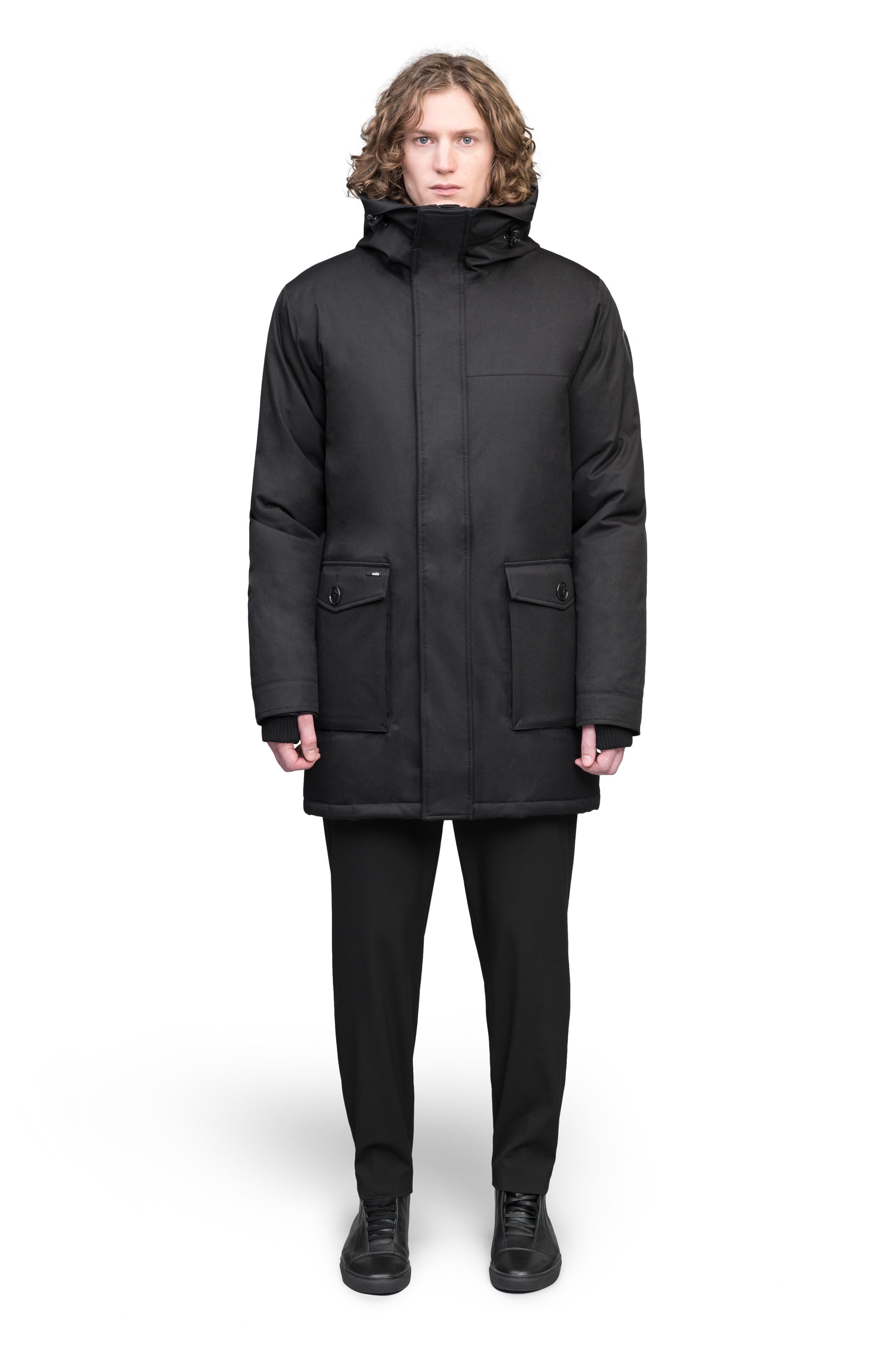 Yves Furless Men's Parka in thigh length, Canadian white duck down insulation, non-removable down-filled hood, flap pockets at waist, centre-front two-way zipper with magnetic wind flap, and elastic ribbed cuffs, in Black