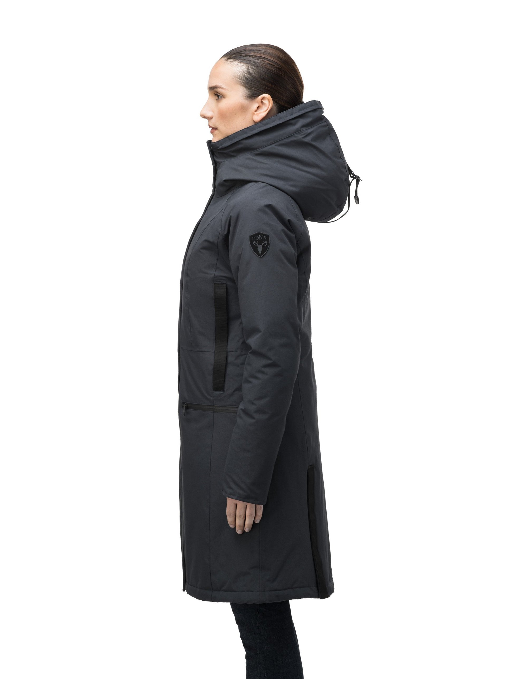 Knee length women's down filled parka with contrast ribbon accents and removable fur trim on the hood in Black