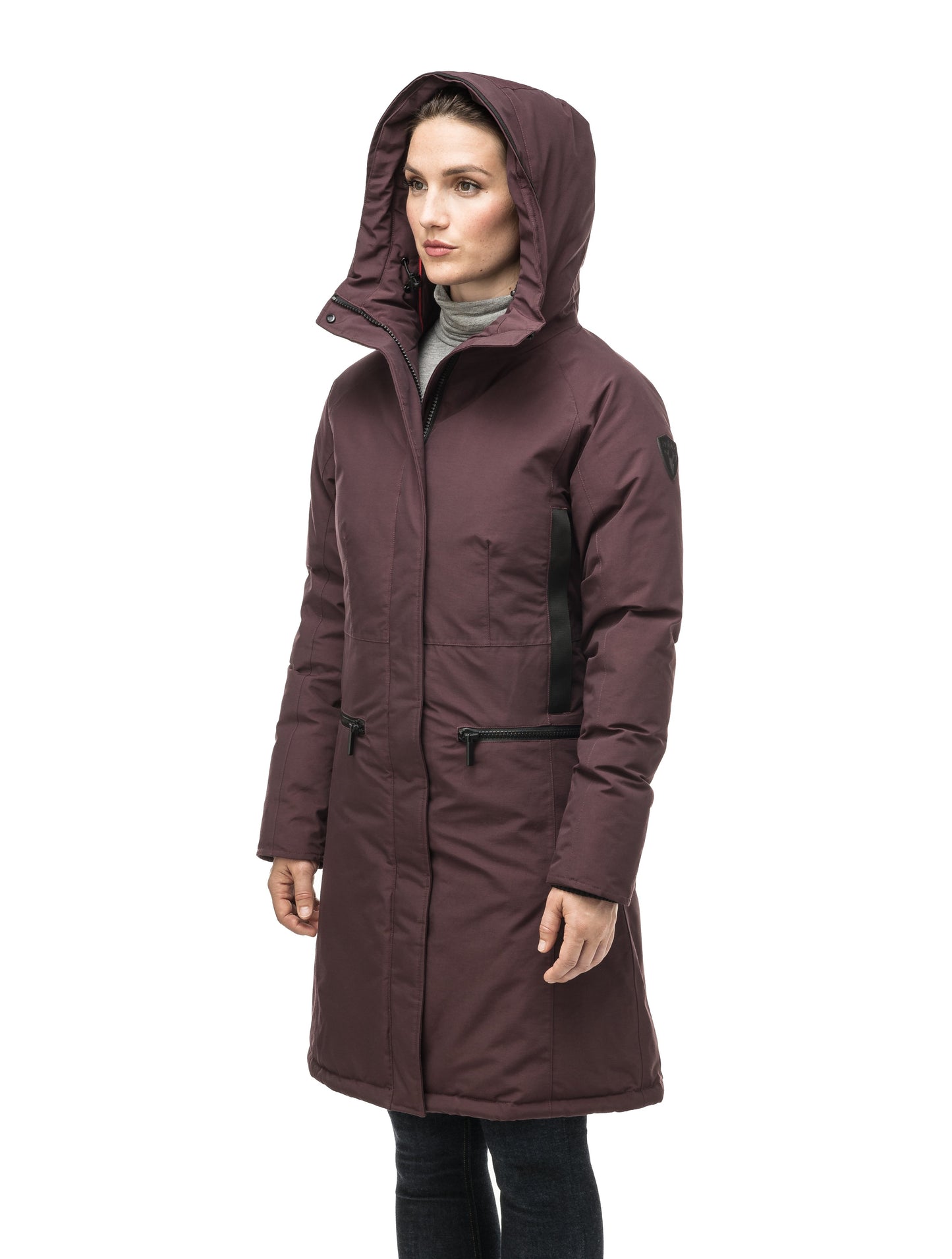 Knee length women's down filled parka with contrast ribbon accents and removable fur trim on the hood in Burgundy
