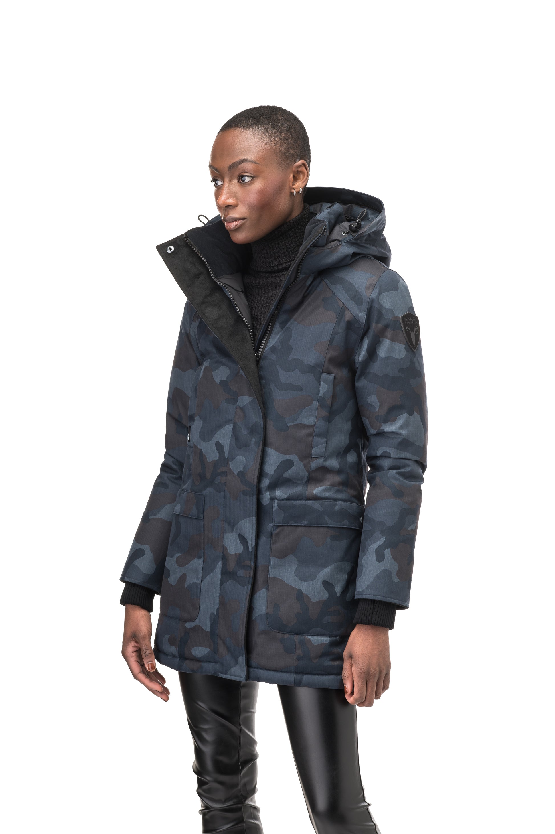 Women's down filled parka that sits just below the hip with a clean look and two hip patch pockets in Navy Camo