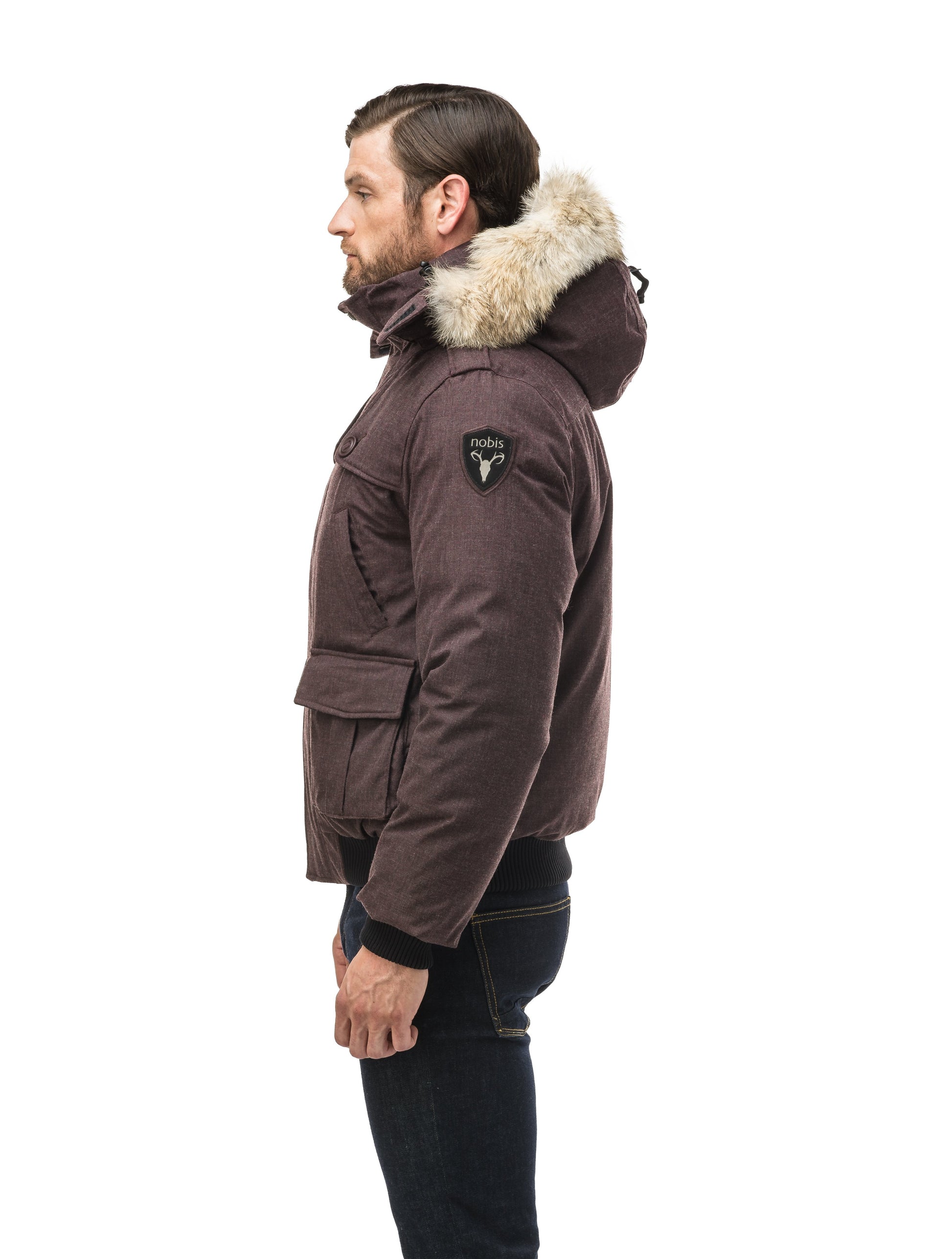 Men's down filled bomber that sits just above the hips with a completely removable hood that's windproof, waterproof, and breathable in H. Burgundy