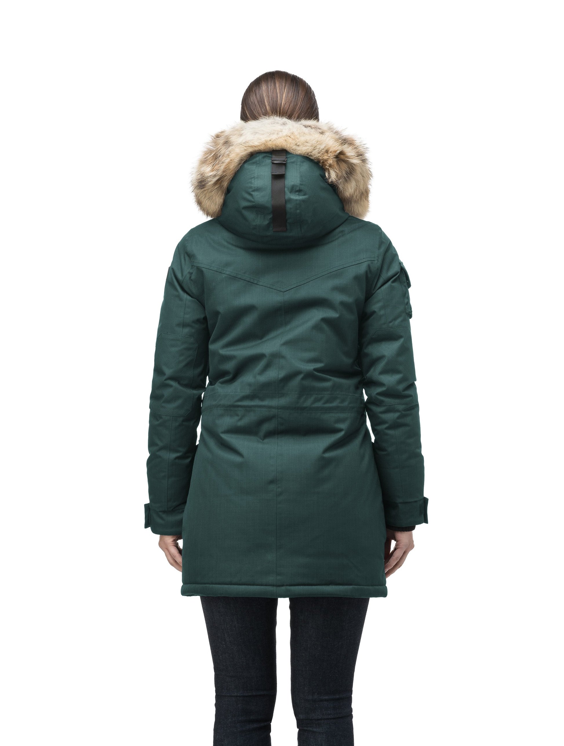 Women's down filled thigh length parka with four pleated patch pockets and an adjustable waist in CH Forest