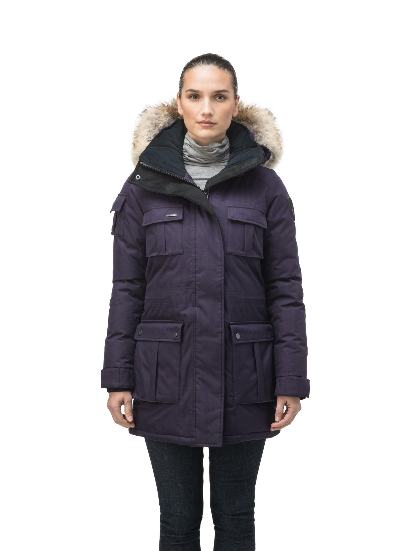 Women's down filled thigh length parka with four pleated patch pockets and an adjustable waist in CH Purple