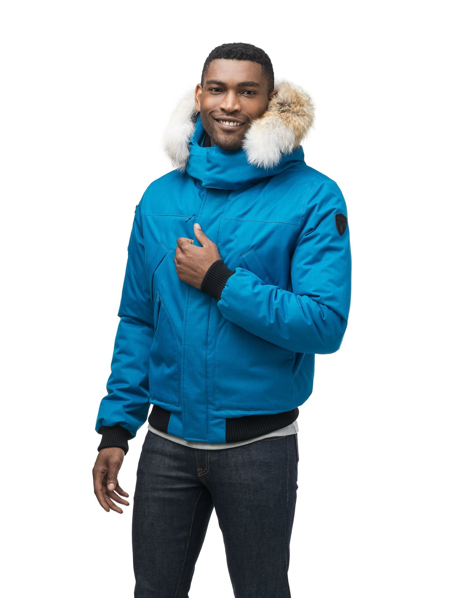 Men's classic down filled bomber jacket with a down filledÃƒâ€šÃ‚Â hood that features a removable coyote fur trim and concealed moldable framing wire in Sea Blue