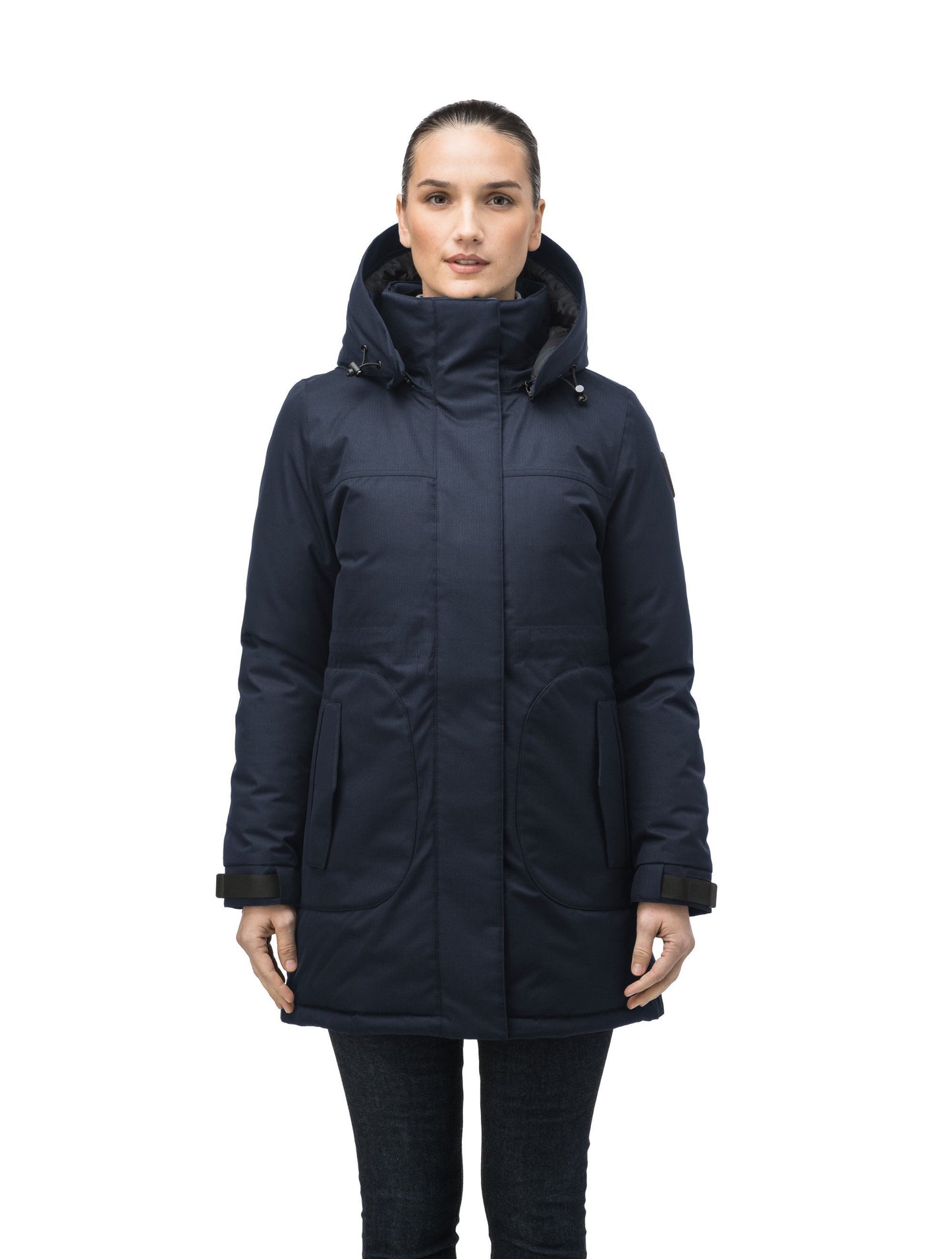 Thigh length women's down filled parka with side entry pockets and drawcord waist, removable hood and fur trim in Navy