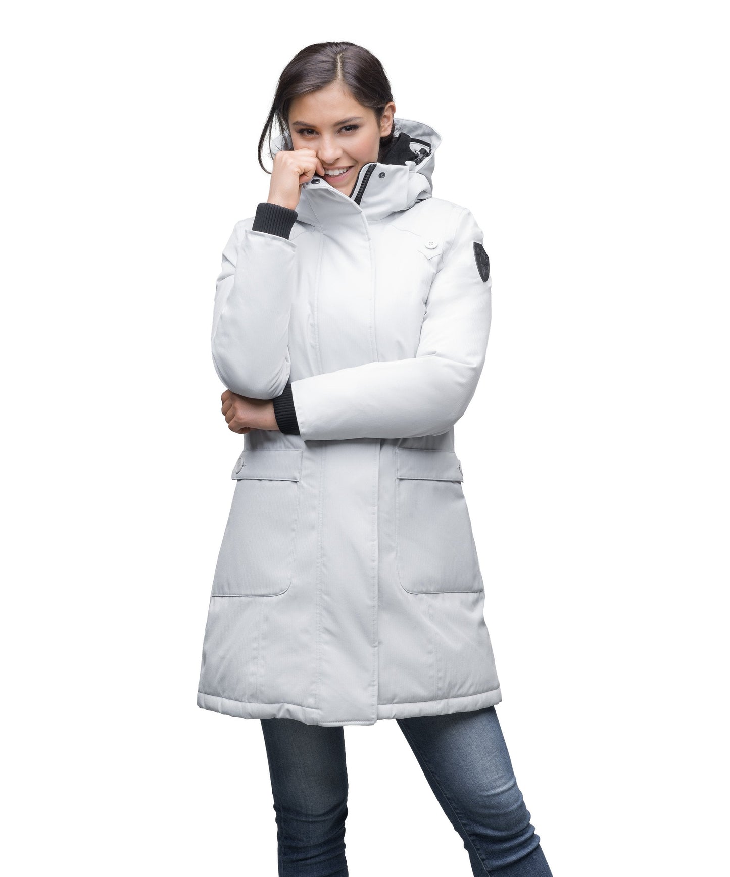 Merideth Furless Ladies Parka in thigh length, Canadian white duck down insulation, removable down-filled hood, centre-front two-way zipper with magnetic wind flap closure, four exterior pockets, and elastic ribbed cuffs, in Light Grey