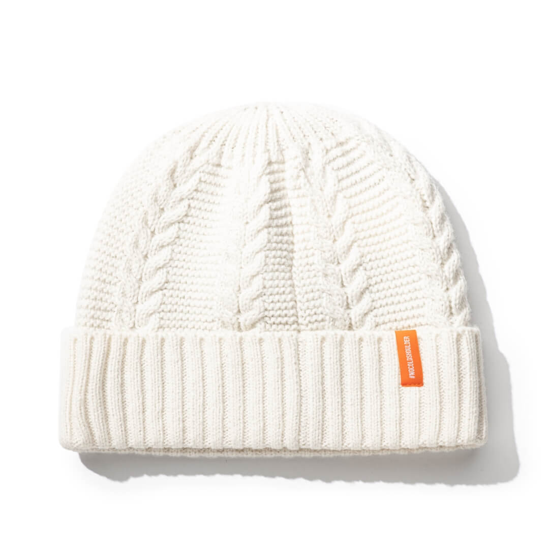 No Cold Shoulder unisex beanie with cable stitched crown, two by two rib knit cuff, with dual orange wrap labels along cuff, in Chalk