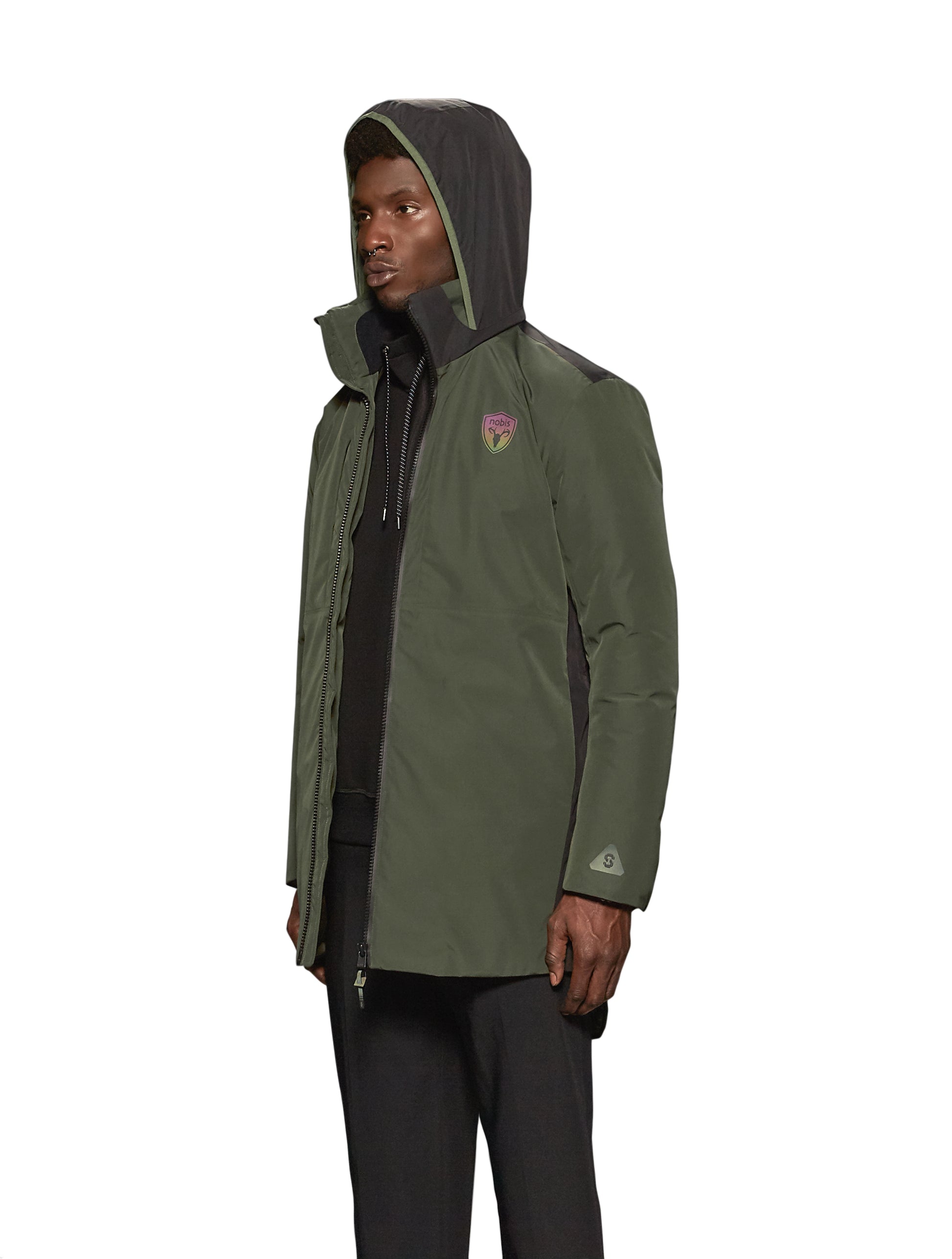Unisex thigh length down parka with a contrast colour back panel, hidable waterproof hood, and hidden zipper pockets at chest and waist, in Fatigue/Black
