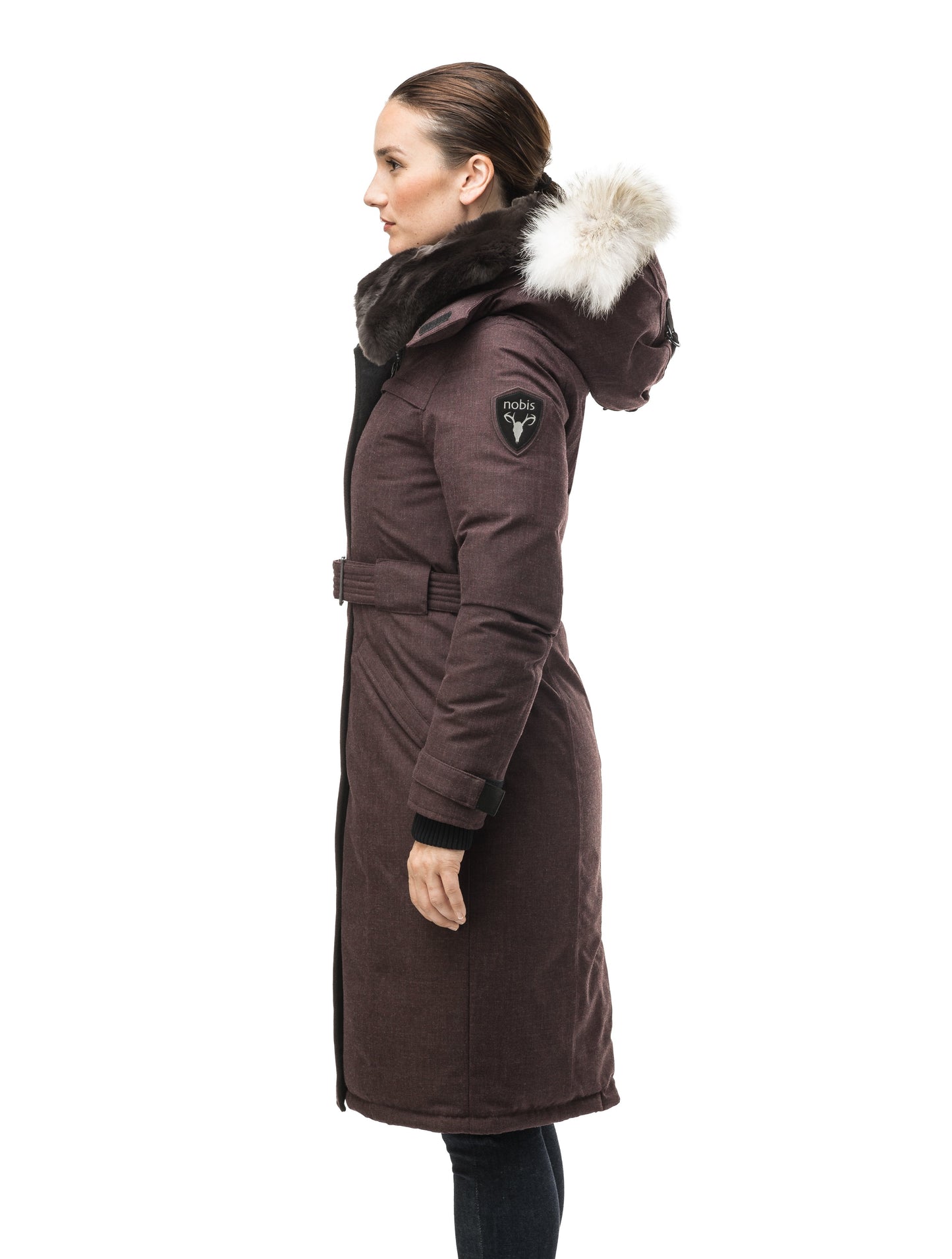 Women's knee length down filled parka with a belted waist and fully removable Coyote and Rex Rabbit fur ruffs in H. Burgundy