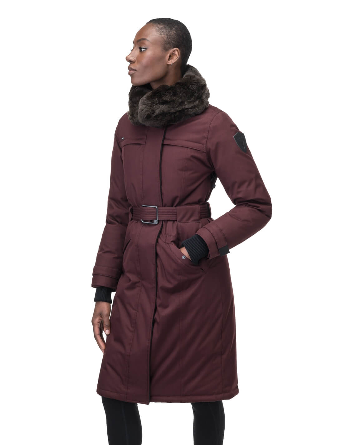 Women's knee length down filled parka with a belted waist and fully removable Coyote and Rex Rabbit fur ruffs in Merlot