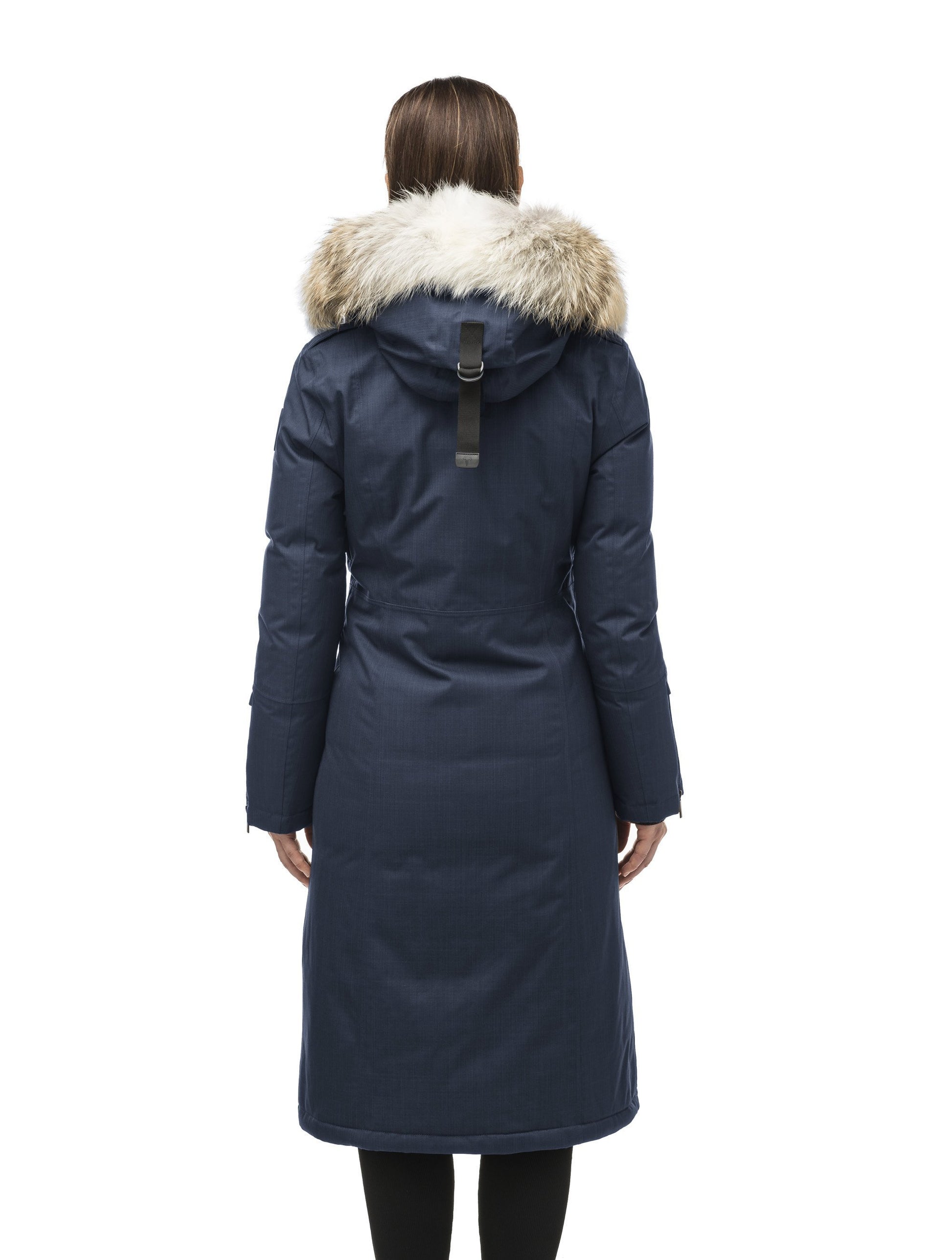 Long calf length women's trench inspired parka with removable fur trim around the hood and an asymetric closure in Navy