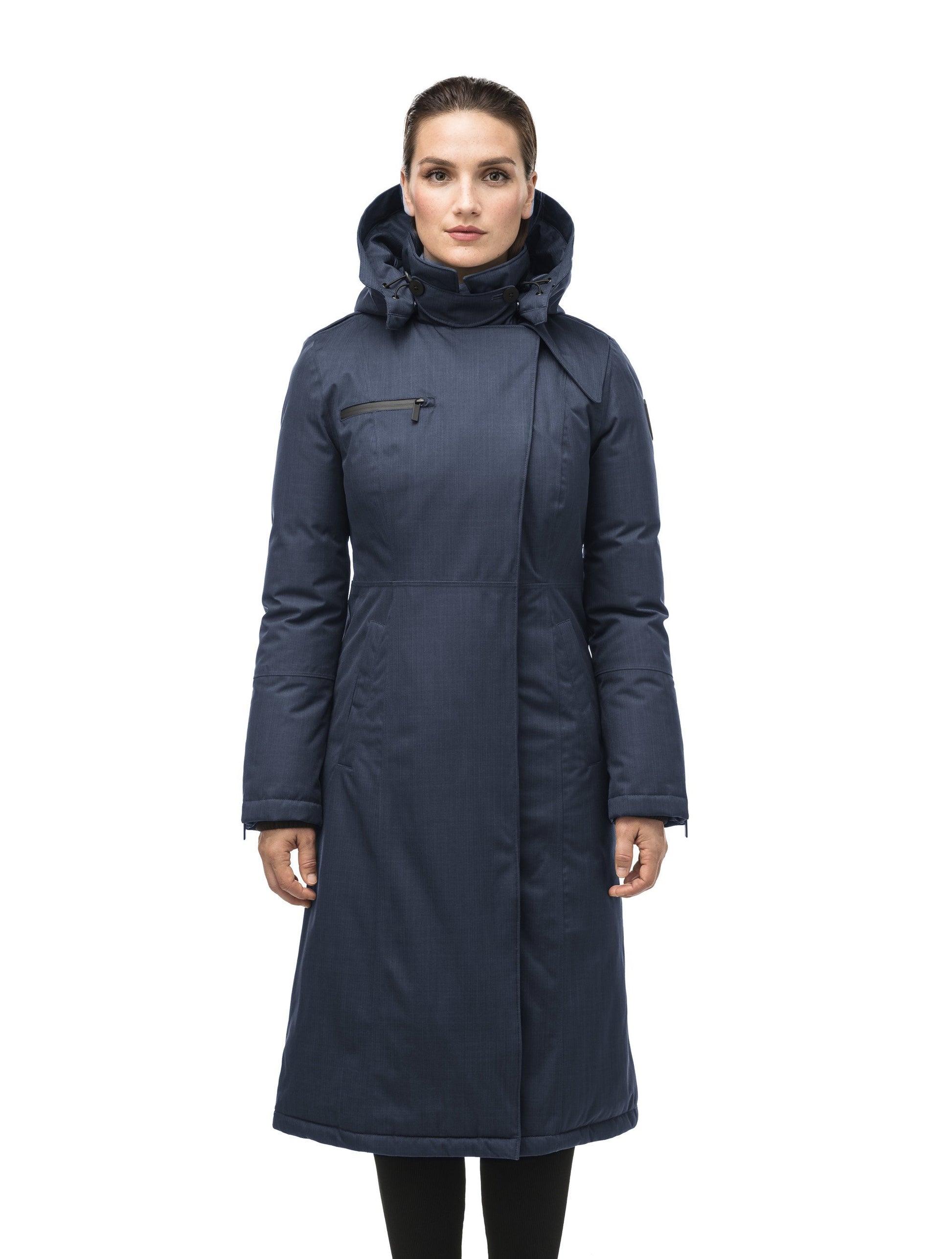 Long calf length women's trench inspired parka with removable fur trim around the hood and an asymetric closure in Navy