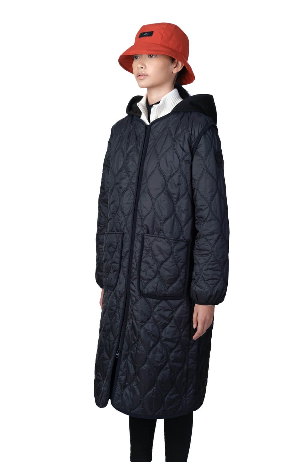 Lunar New Year Ladies Quilted Long Jacket in knee length, sustainable and environmentally friendly Primaloft Gold Insulation Active+, with removable fleece hood, two-way front zipper, two waist patch pockets, and diamond quilted body, in Black