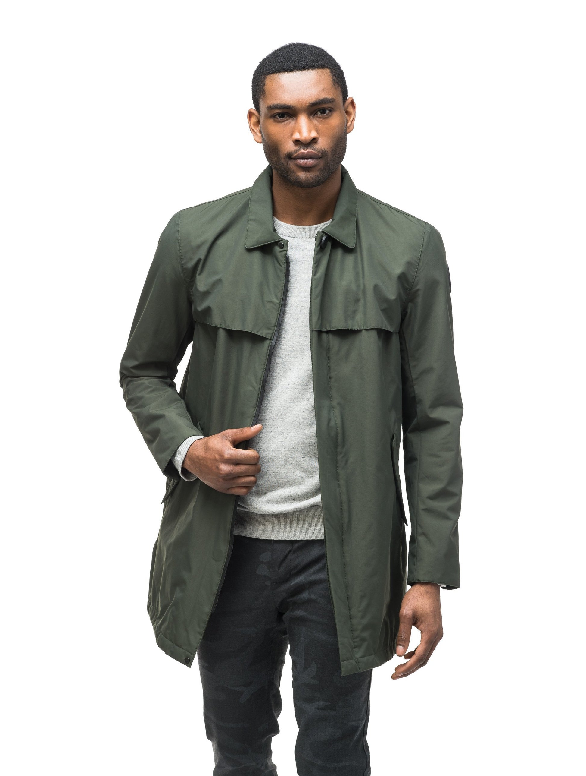 Men's waist length raincoat with a magnetic placket and top button detail in Dk Forest