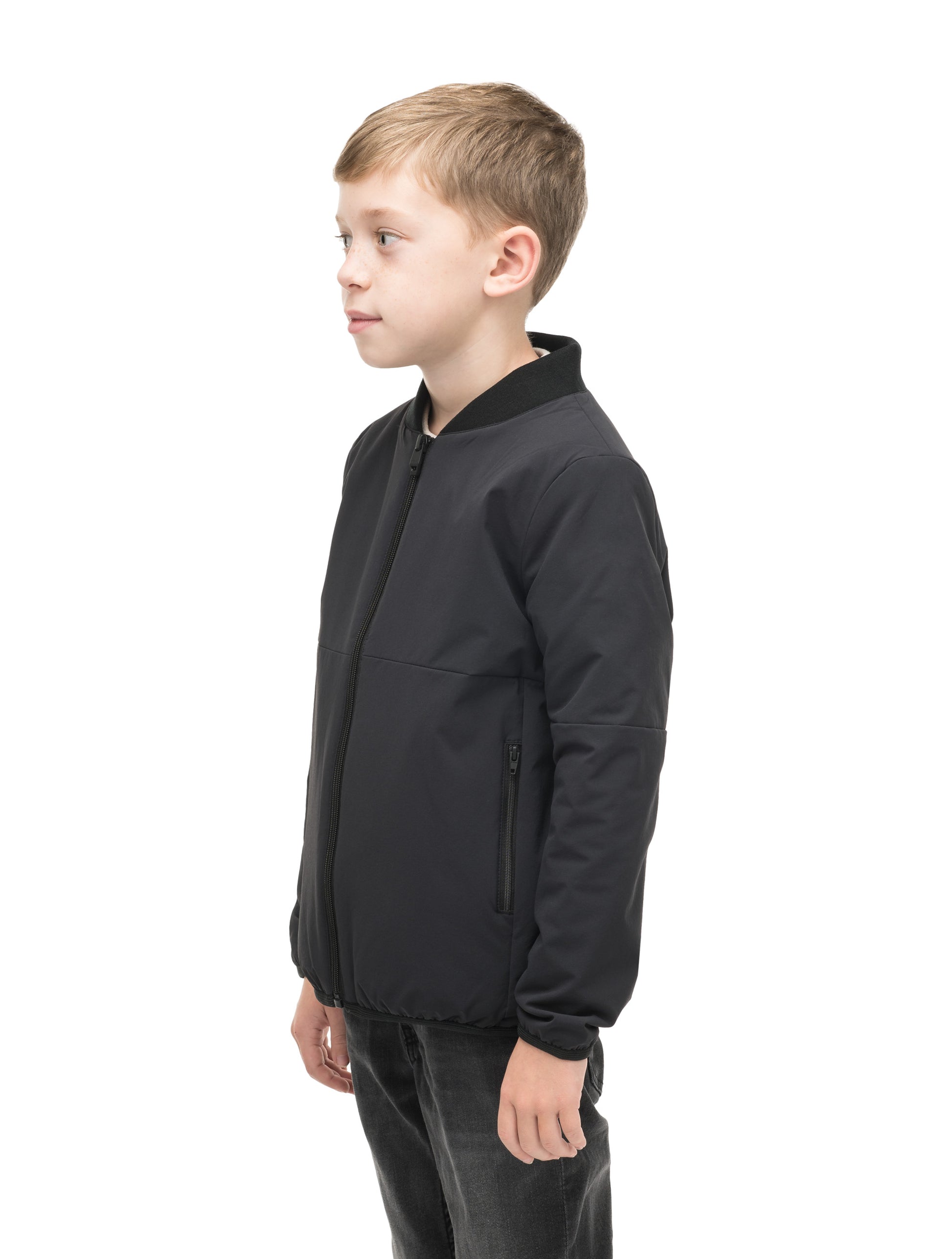 Little Ursa Kids Mid Layer Jacket in hip length, Primaloft Gold Insulation Active, ribbed collar, and two-way front zipper, in Black